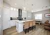 Beautiful kitchen with breakfast bar that seats three 