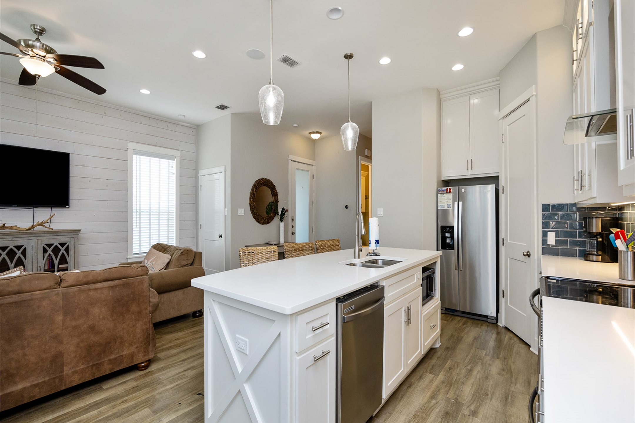 Open layout connecting the kitchen to the living and dining areas