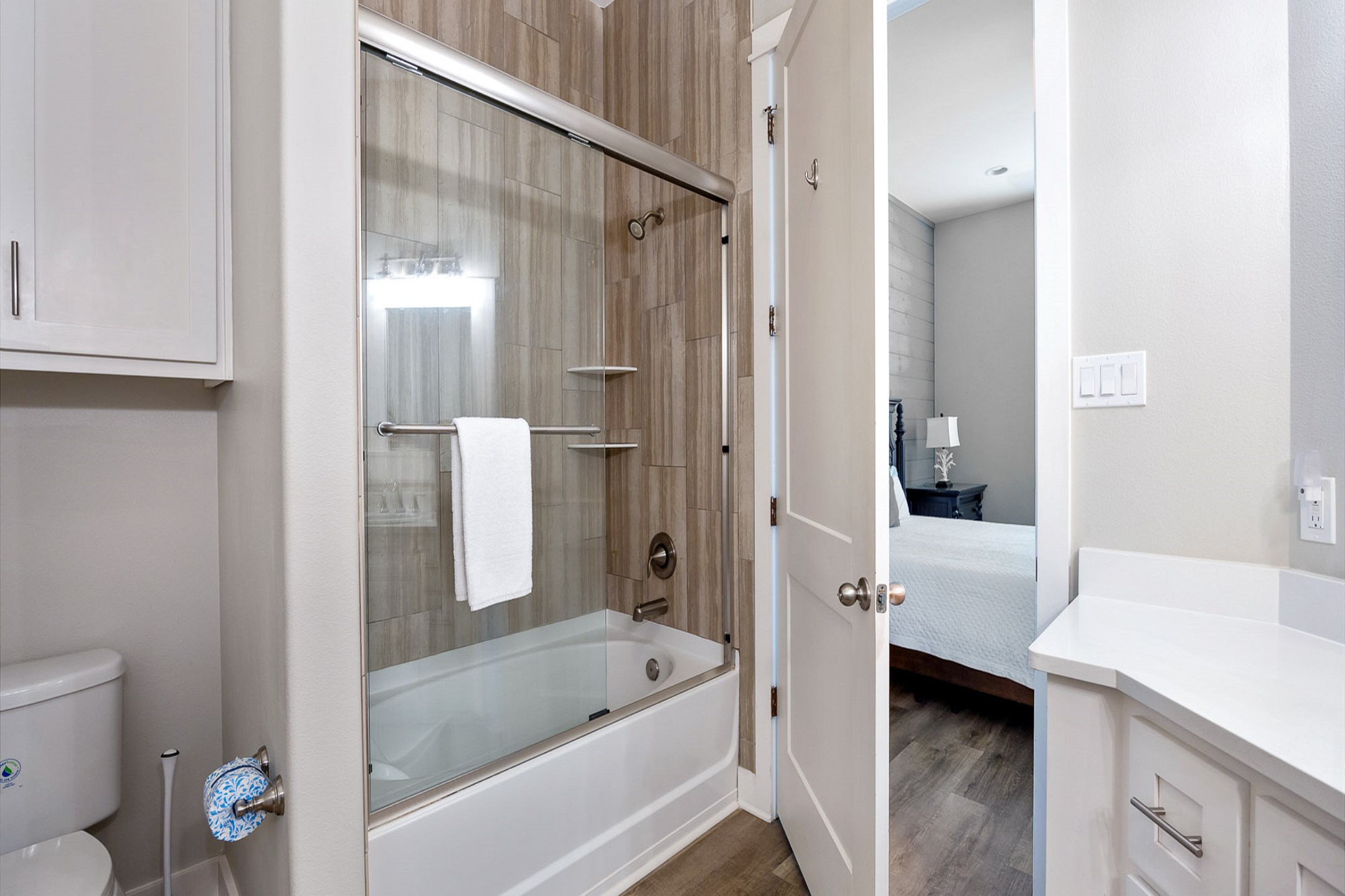 Stylish third-floor master bathroom with a contemporary double sink and a tub-shower combo