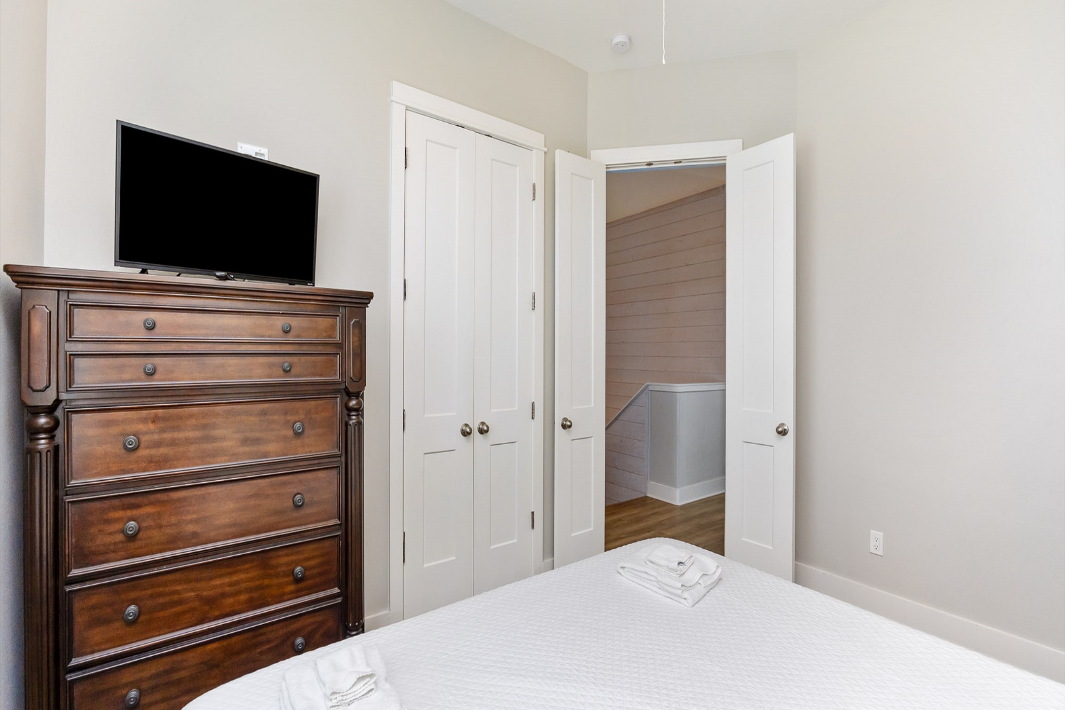 Third bedroom on the third floor with a king size bed and flat screen TV