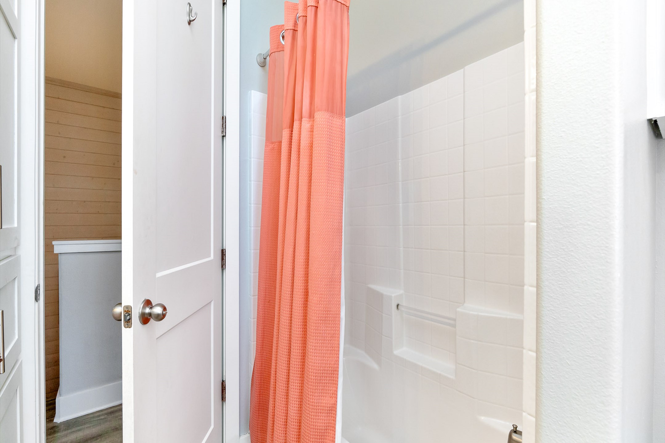 Third-floor guest bathroom with double sinks and a tub-shower combo