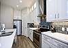 Second floor modern kitchen with stainless steel appliances 