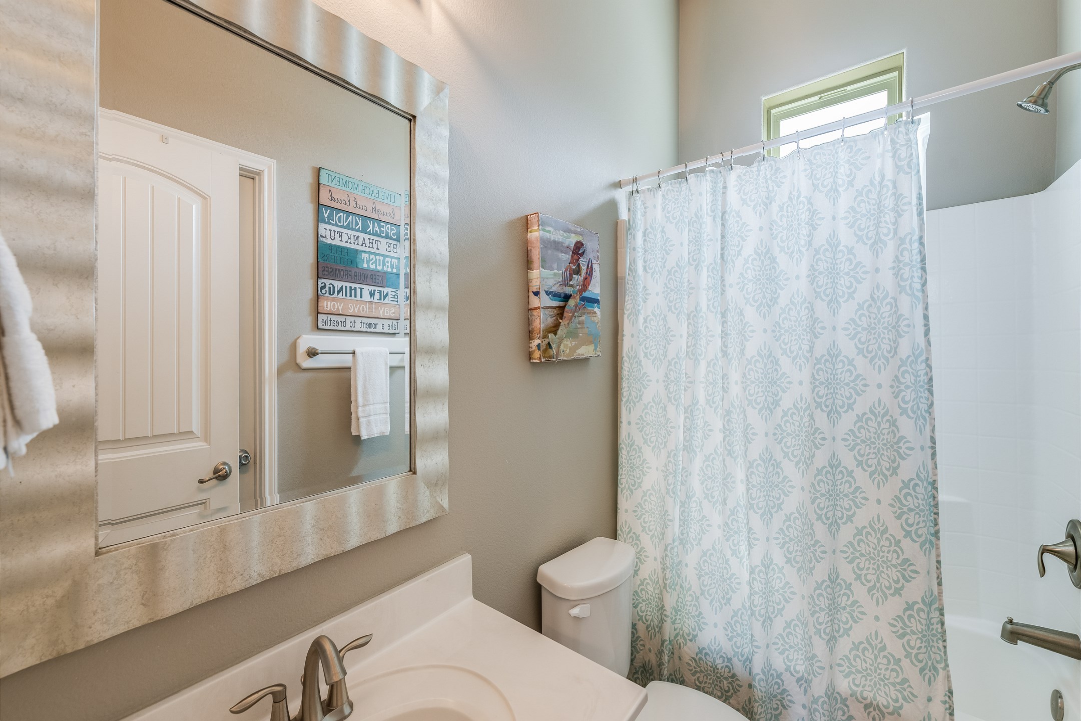 Private bathroom off the second bedroom with tub/shower combo