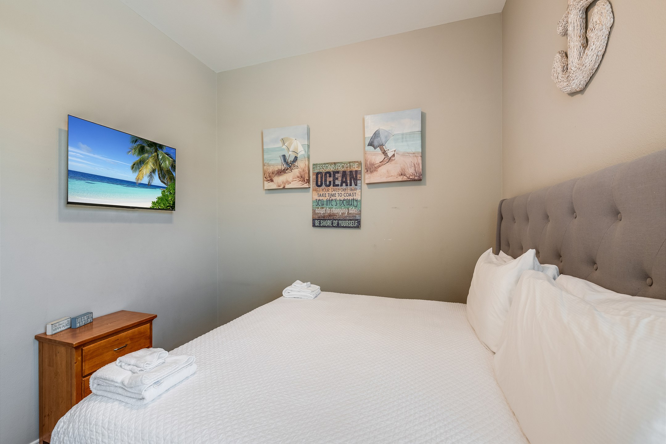 Primary bedroom on the first floor with king size bed and flat screen TV