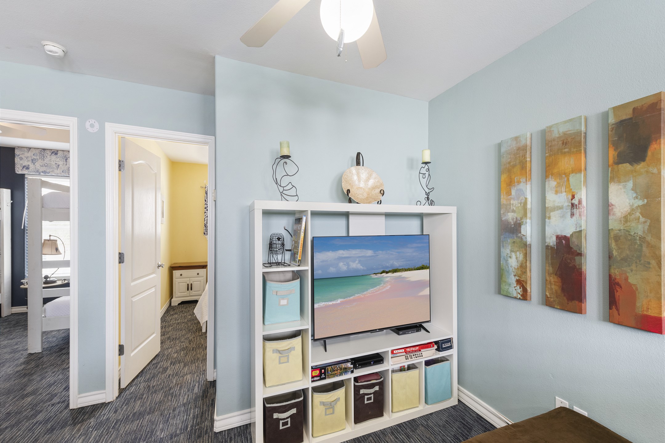 Loft space on the second floor with cozy seating to relax on and enjoy the flat screen TV