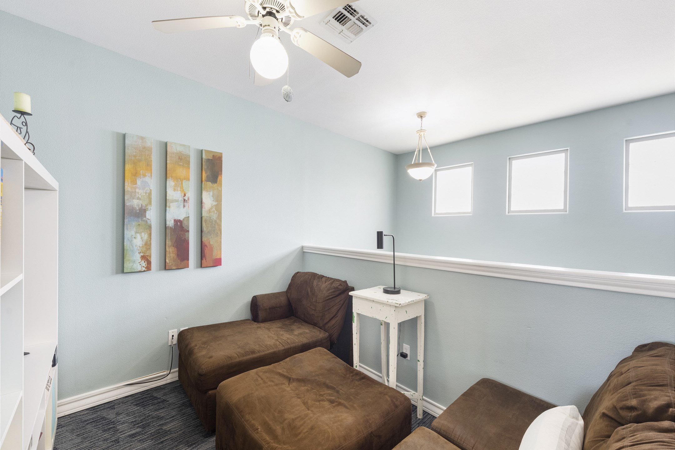 Loft space on the second floor with cozy seating to relax on and enjoy the flat screen TV