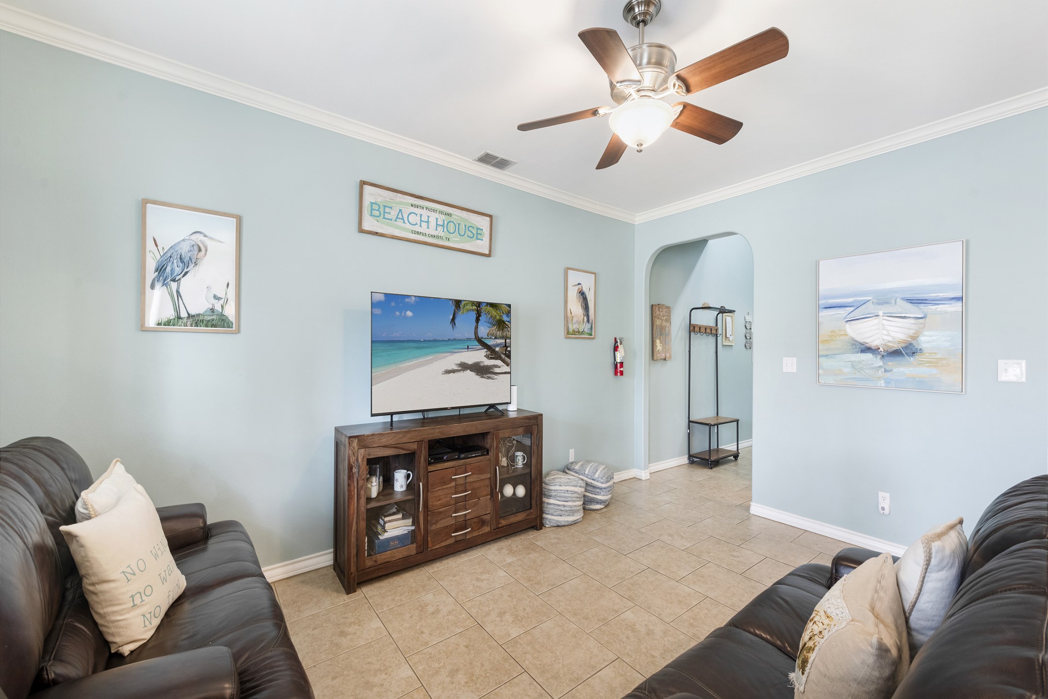 Versatile living area featuring a harmonious blend of comfort and style, ideal for both relaxation and entertaining