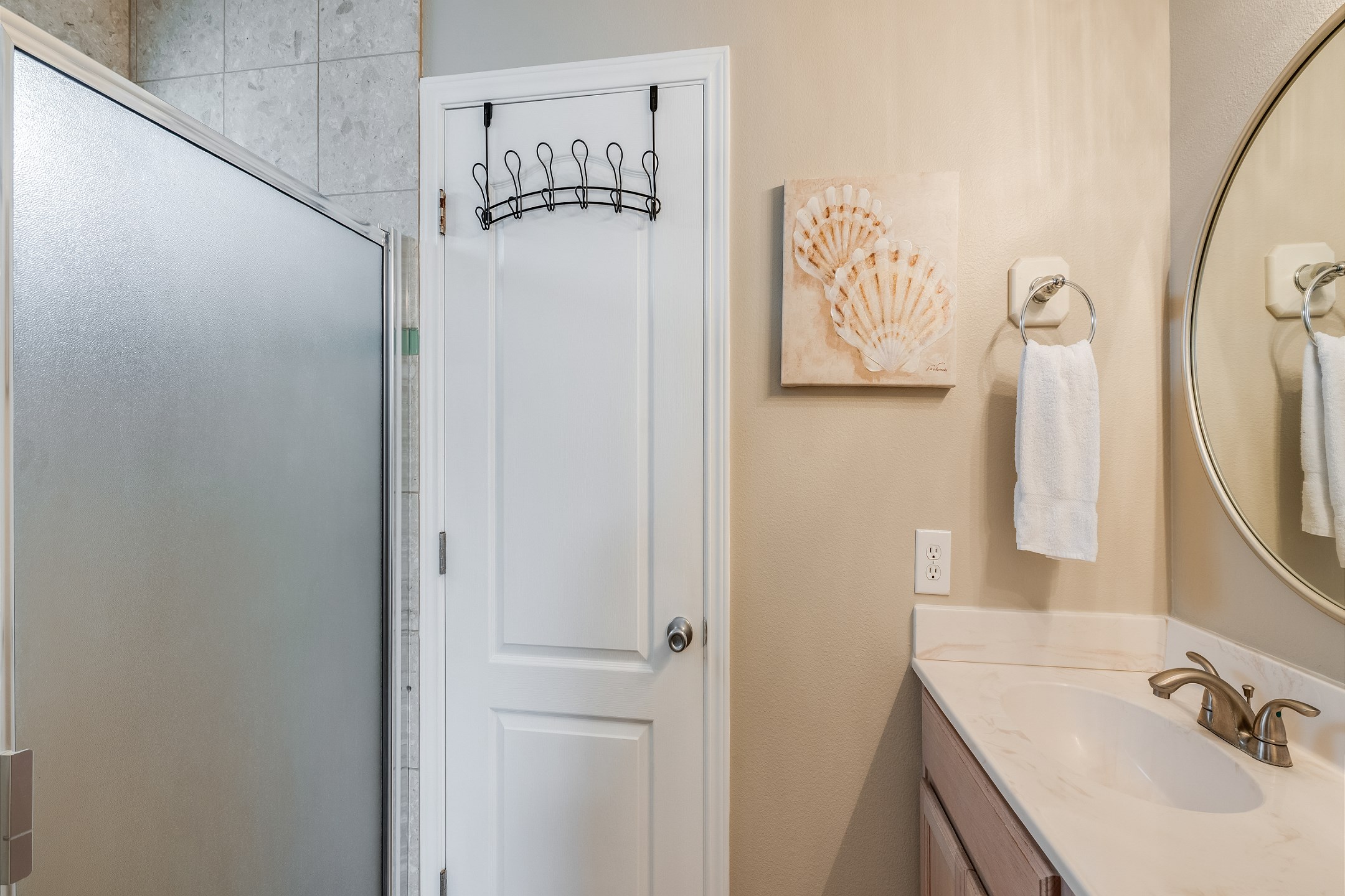 Tucked between two bedrooms for total convenience this guest bath has a shower tub combination