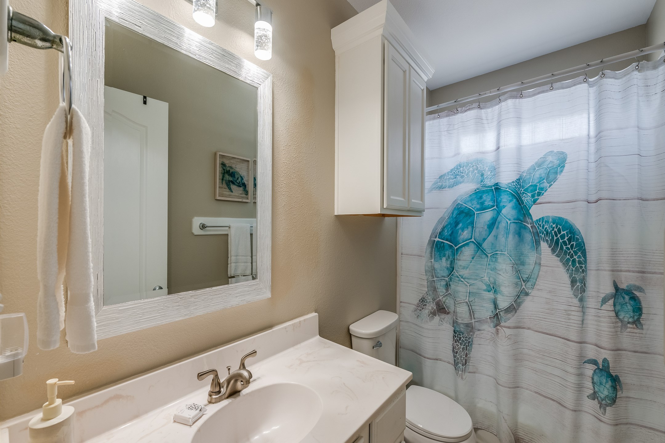 Tucked between two bedrooms for total convenience this guest bath has a shower tub combination.