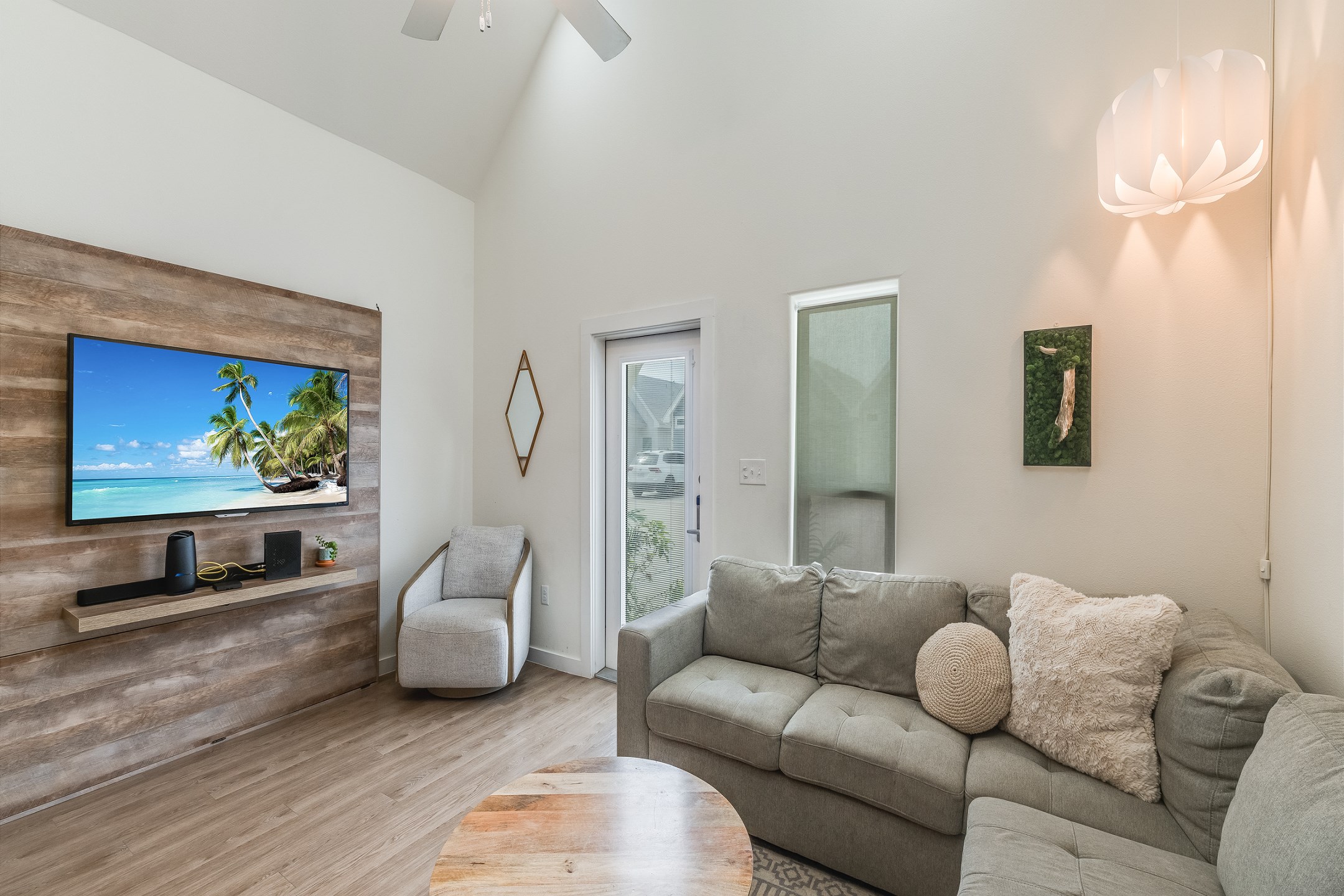 Unwind in comfort with plenty of room for the family in this open living room with flat-screen tv.