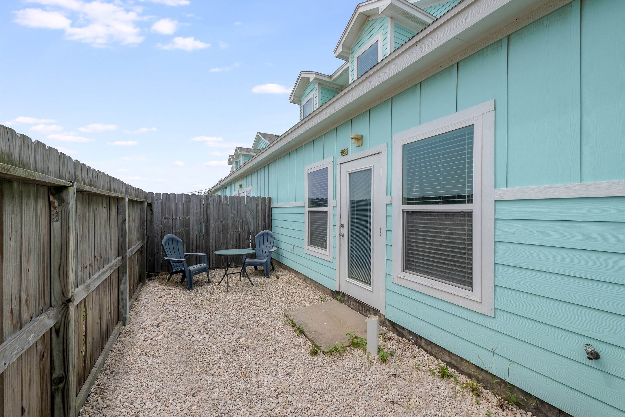 Private backyard area with outdoor seating