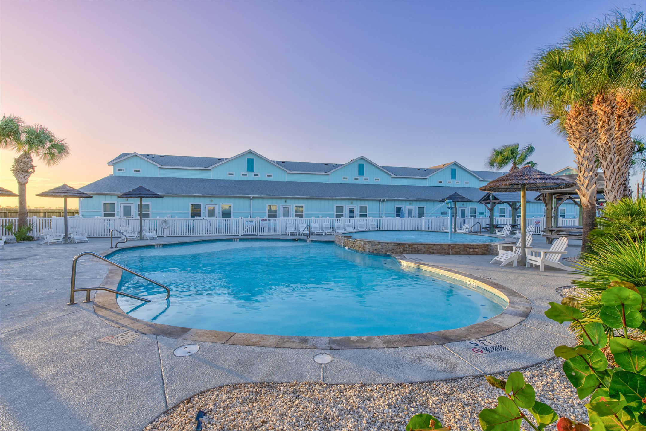 Marvel in the serene views of the sunset while refreshing yourself in the heated pool