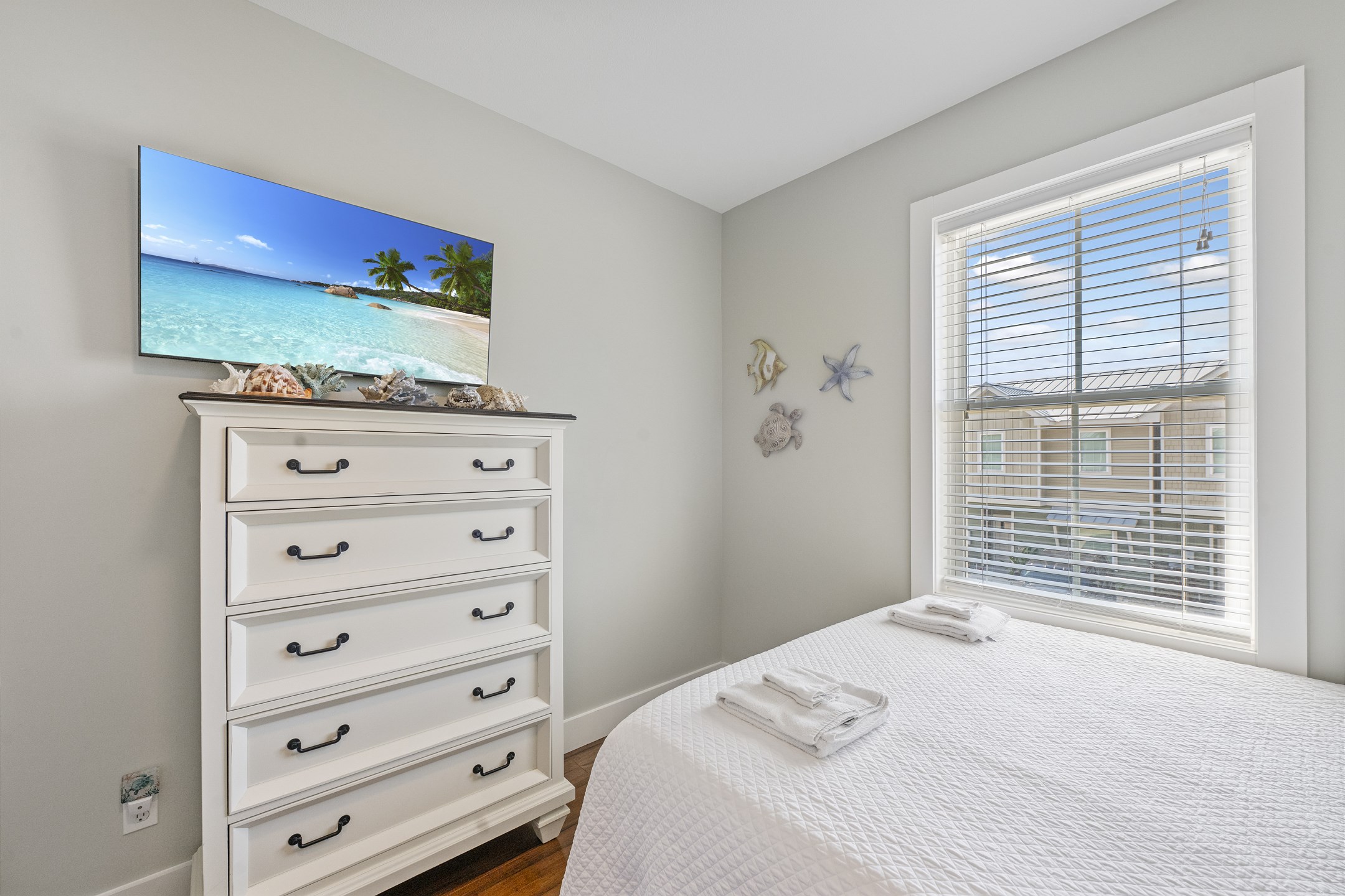 Third bedroom on the second floor with two queen size beds and flat screen TV to enjoy 