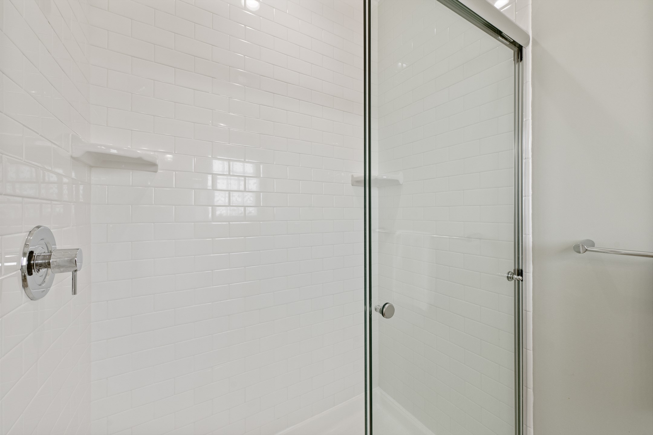 Private bathroom off the second bedroom has double vanities and a spacious, tiled walk-in shower, perfect for getting ready for your vacation adventures