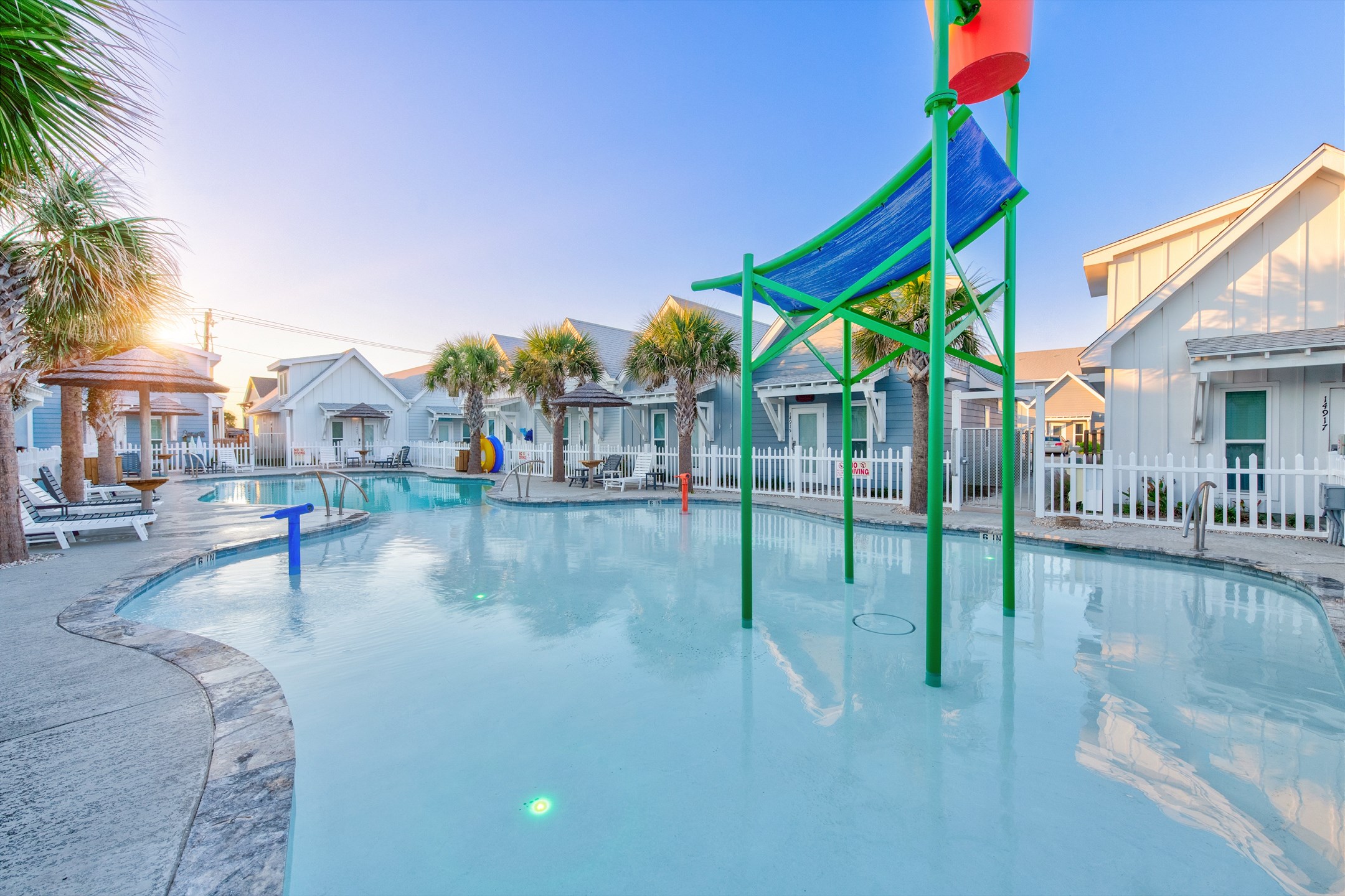 Relax at this family-friendly community pool, featuring sparkling waters, splash down features, and shaded seating