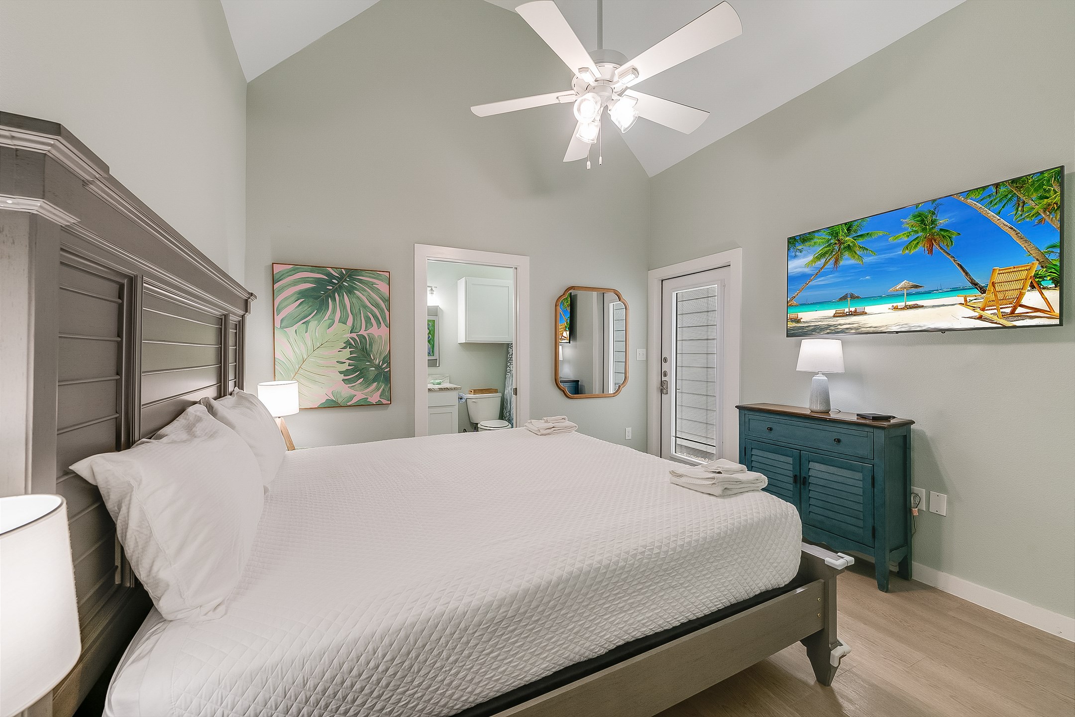 Tropical touches & a private bath make this master a retreat