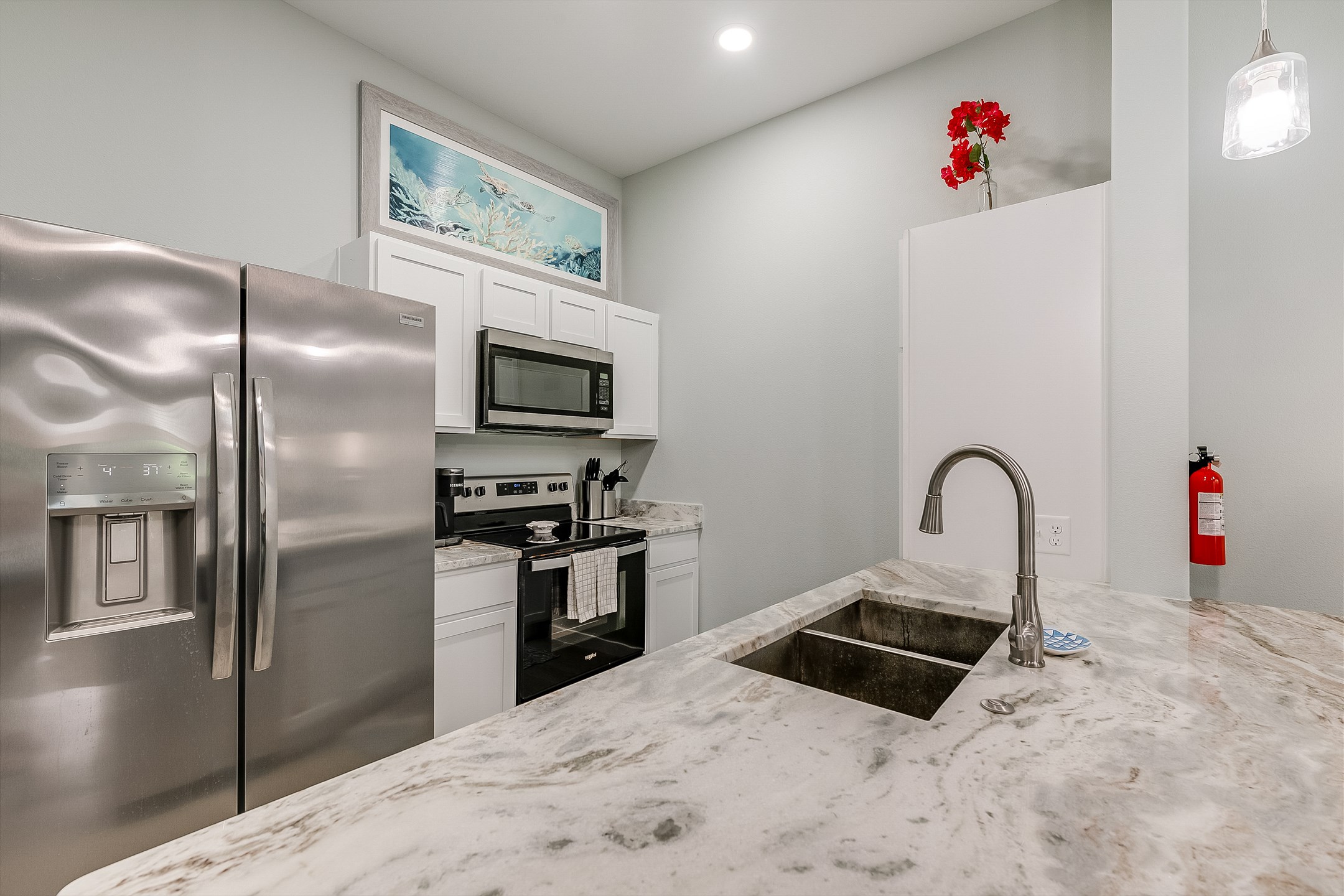 Modern and beachy meets functional in this fully equipped kitchen