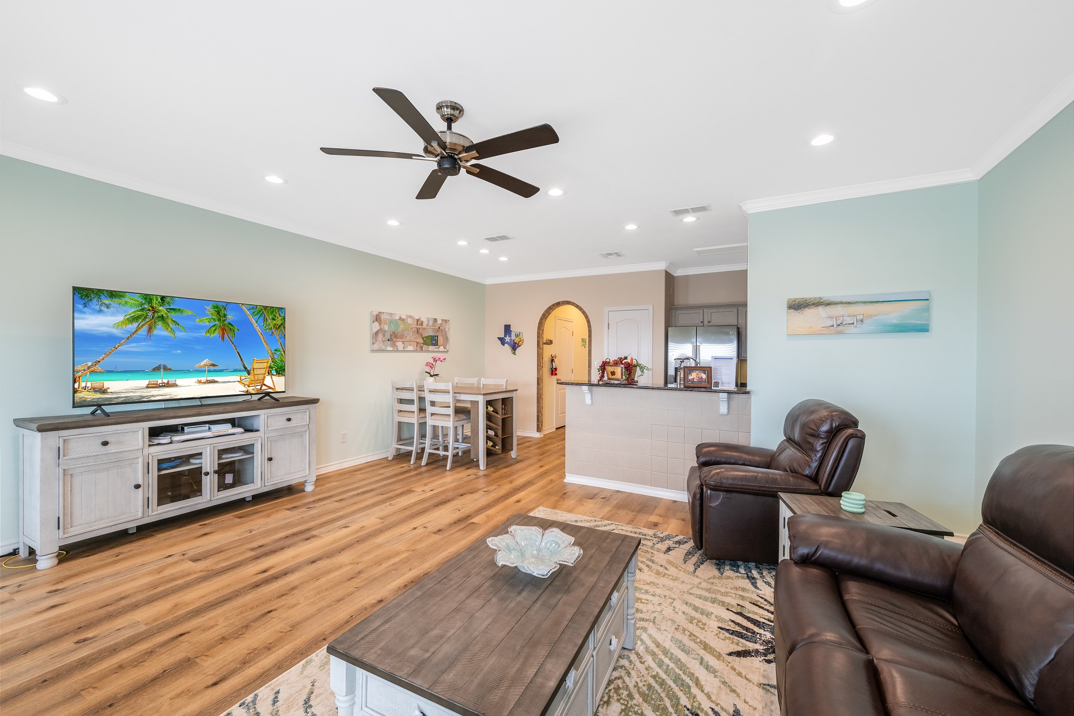 The open-concept layout connects the living room to the kitchen and dining area for easy entertaining