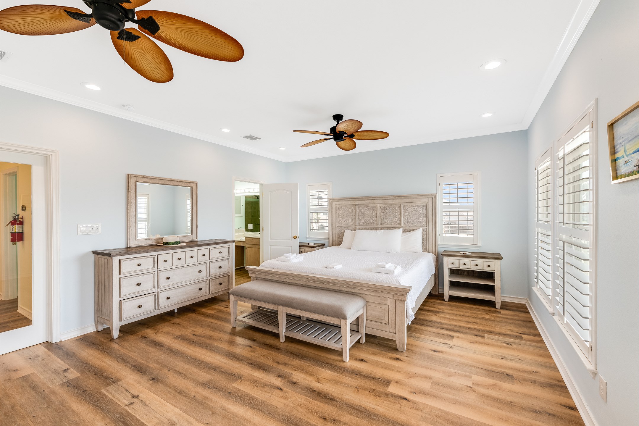 Primary bedroom on the second floor with king size bed, private bathroom and private balcony 