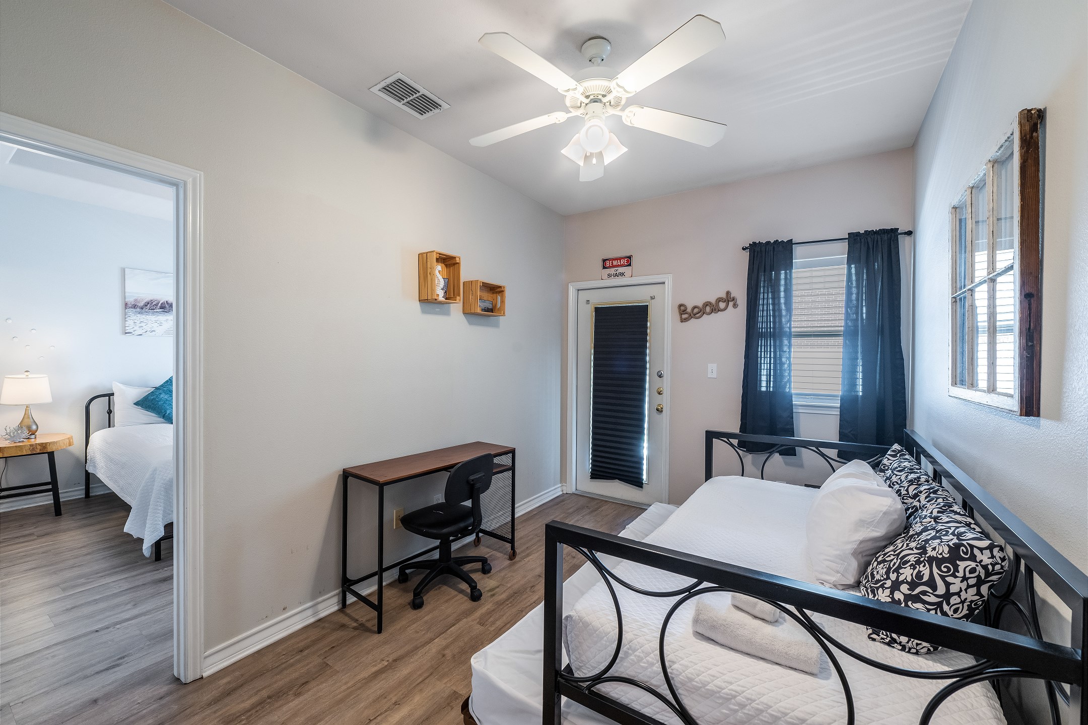 Upstairs loft features a work station and twin daybed with twin trundle—perfect for relaxing or extra sleeping space.