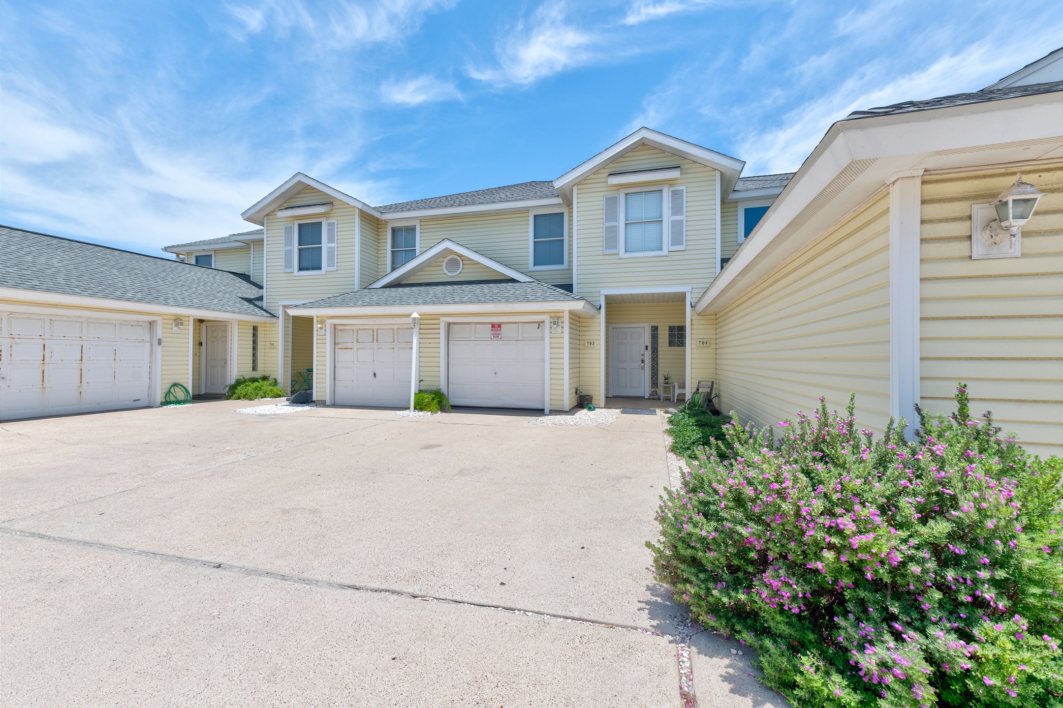 Garage access with parking for one vehicle and reserved parking for one. 