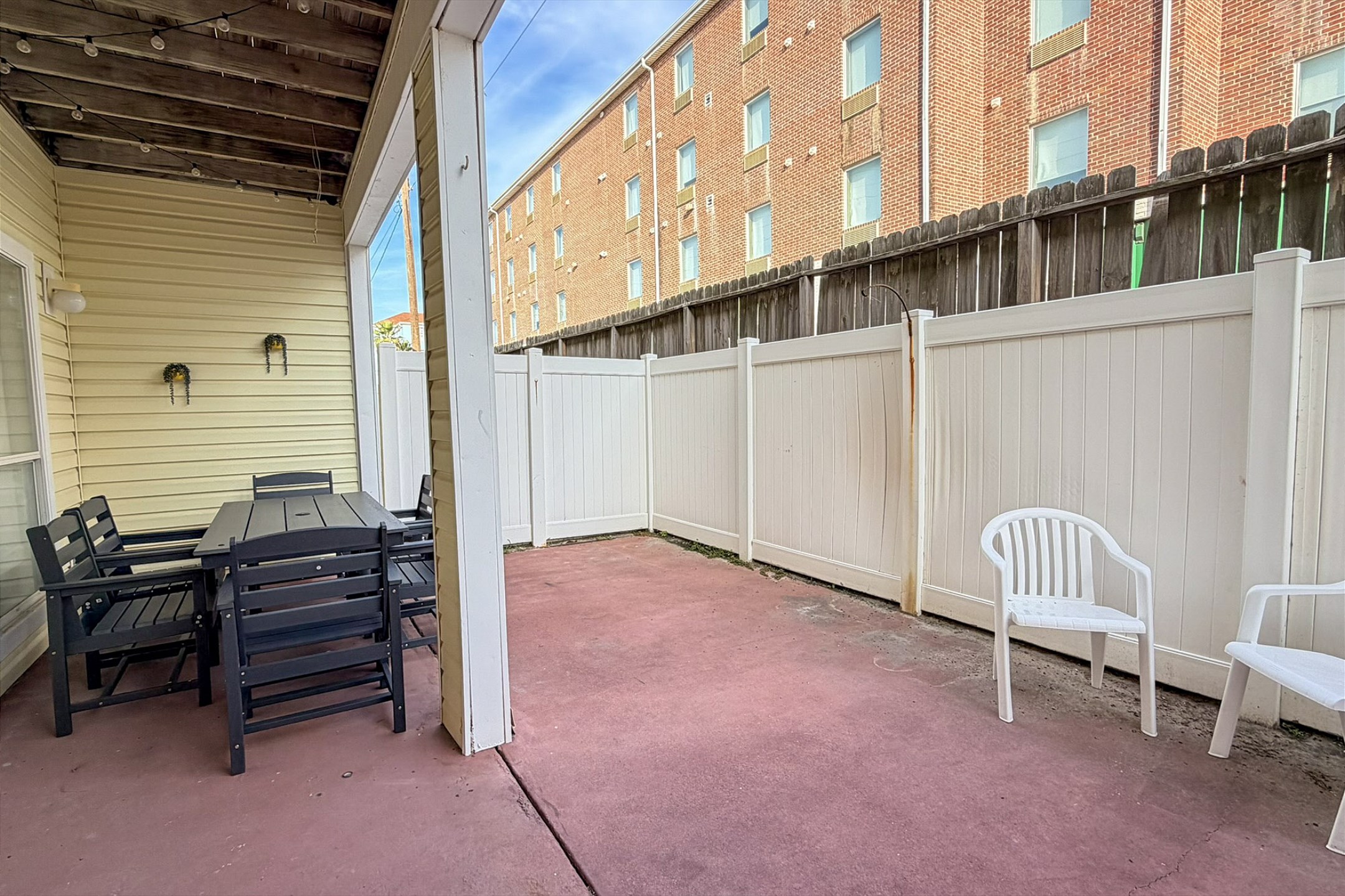 Great back patio space with seating for the whole family 