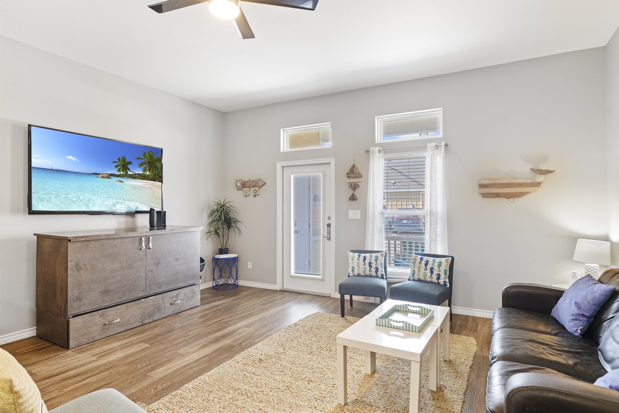 Bright open living area featuring a flat-screen TV—perfect for relaxing