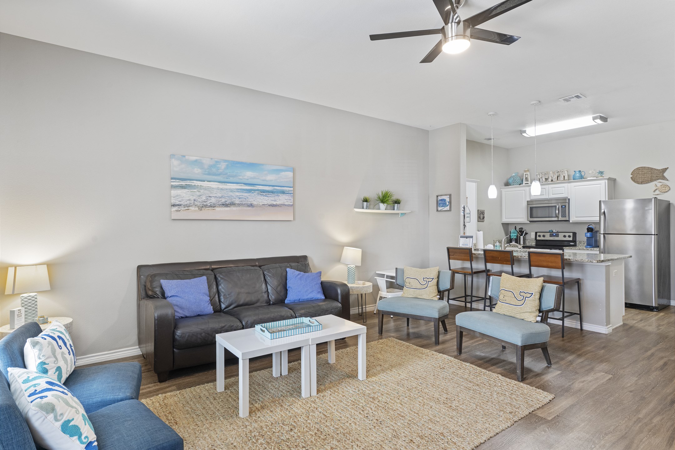 Enjoy a breezy, open layout that seamlessly connects living, dining, and kitchen spaces—perfect for laid-back gatherings and easy vacation living