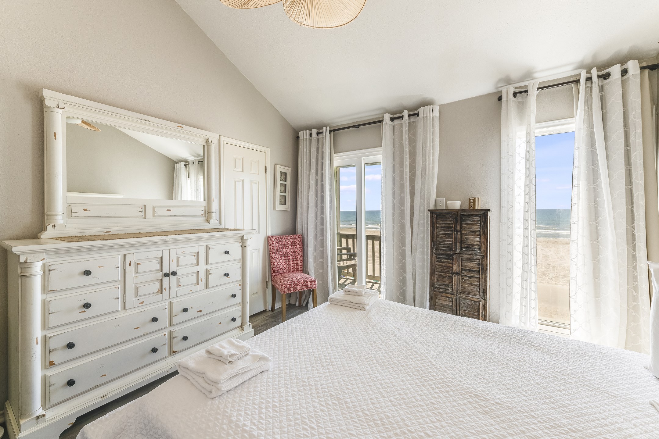 Watch the waves from bed, then step out to your own private balcony to soak it all in