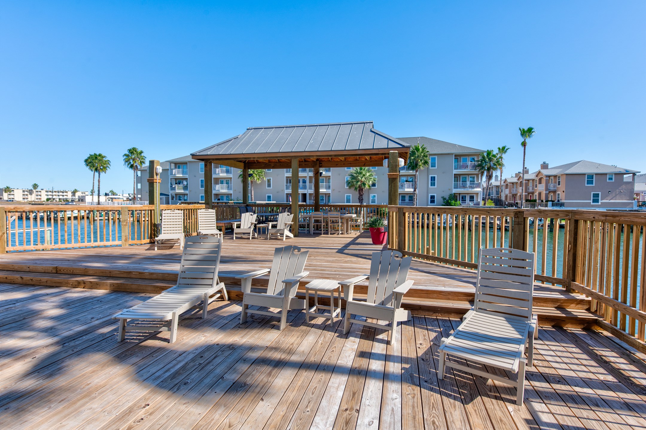 Large deck space with cozy lounge chairs that over look the canal waters