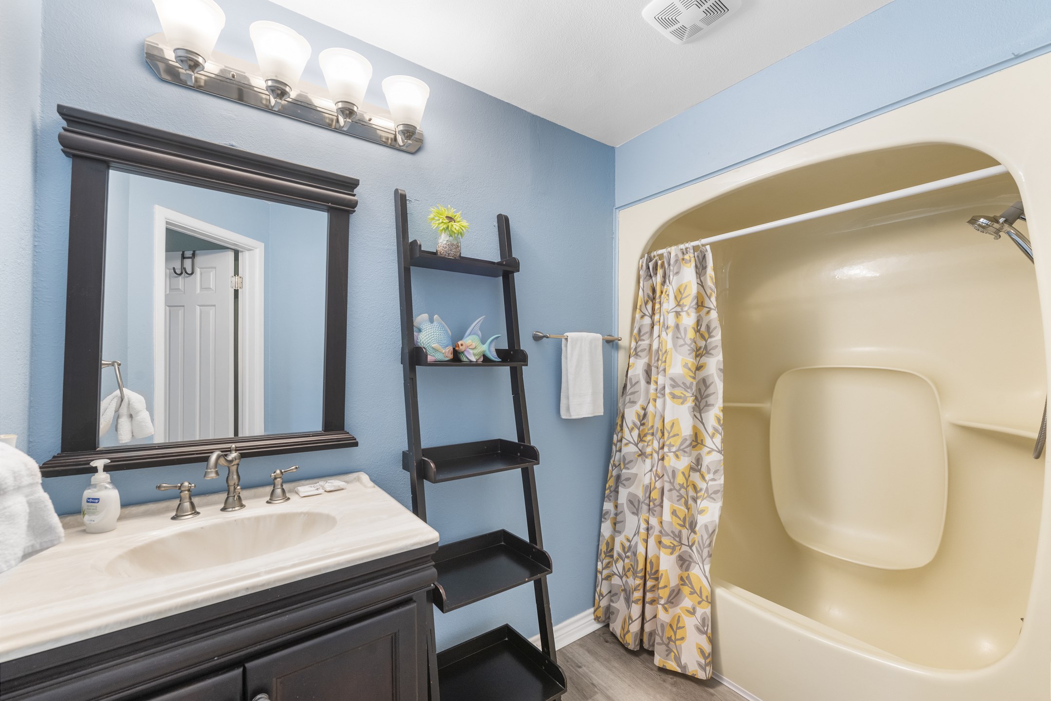 Updated master bath with a tub/shower combo—perfect for relaxing after a day of exploring