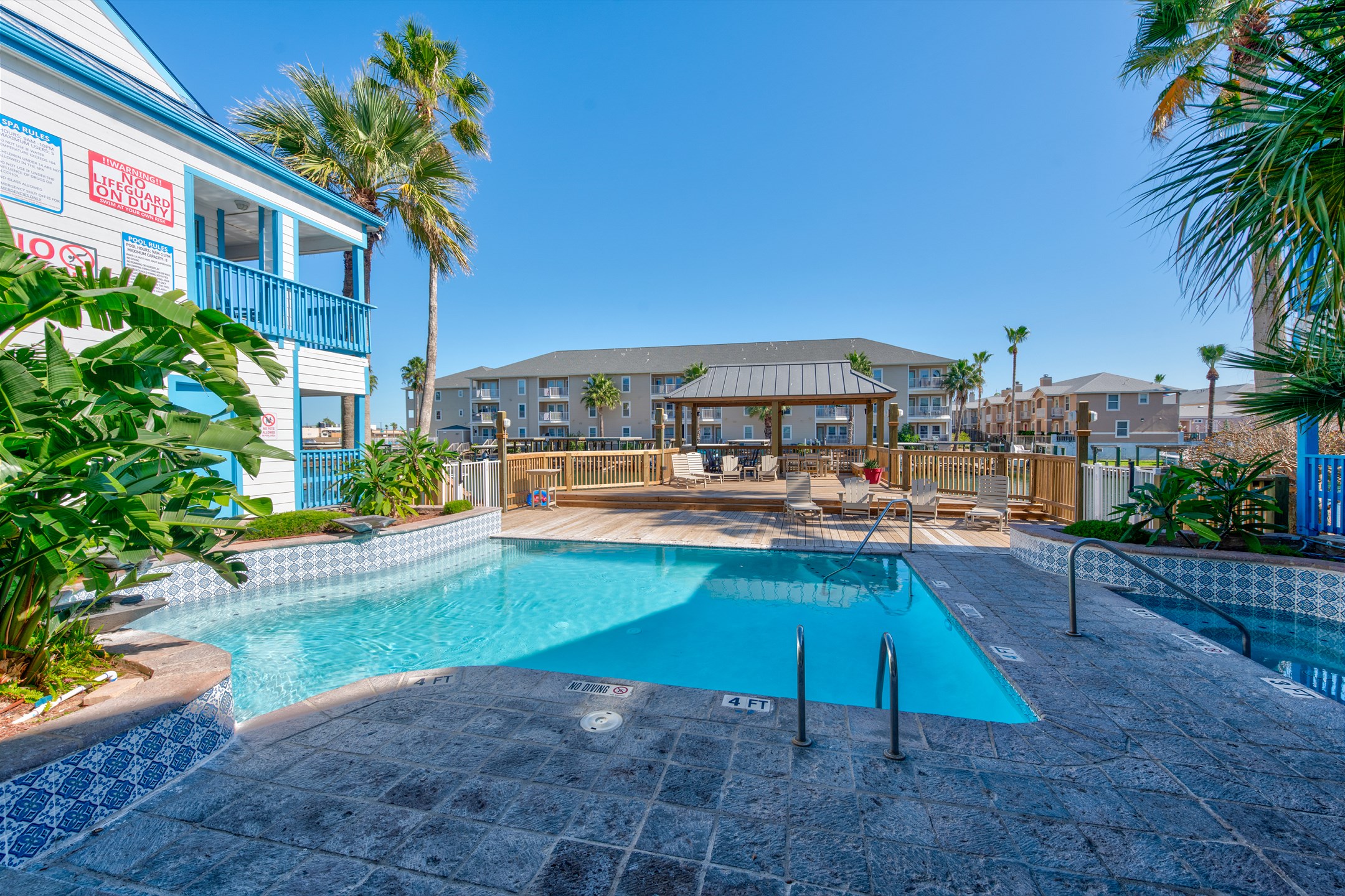 Discover serenity and unwind at the community pool with beautiful canal views