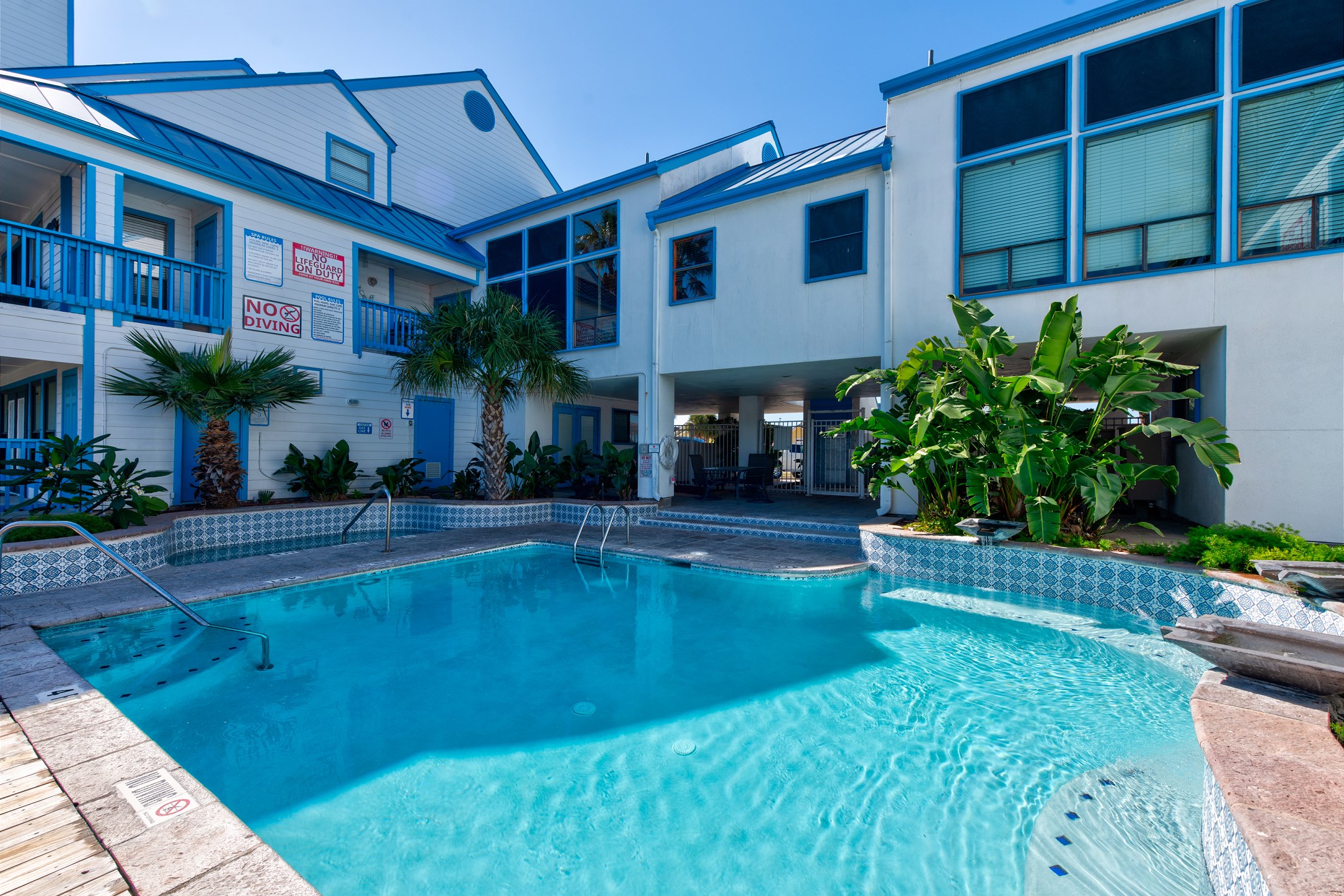 Experience endless fun at Spinnaker pool and hot tub, surrounded by tropical ambiance