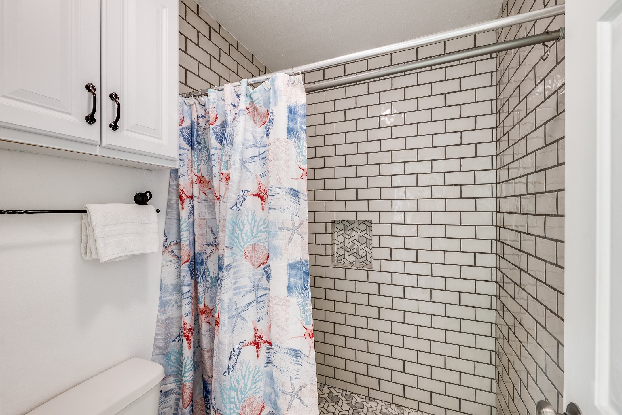 Wash the sand away in the walk in shower