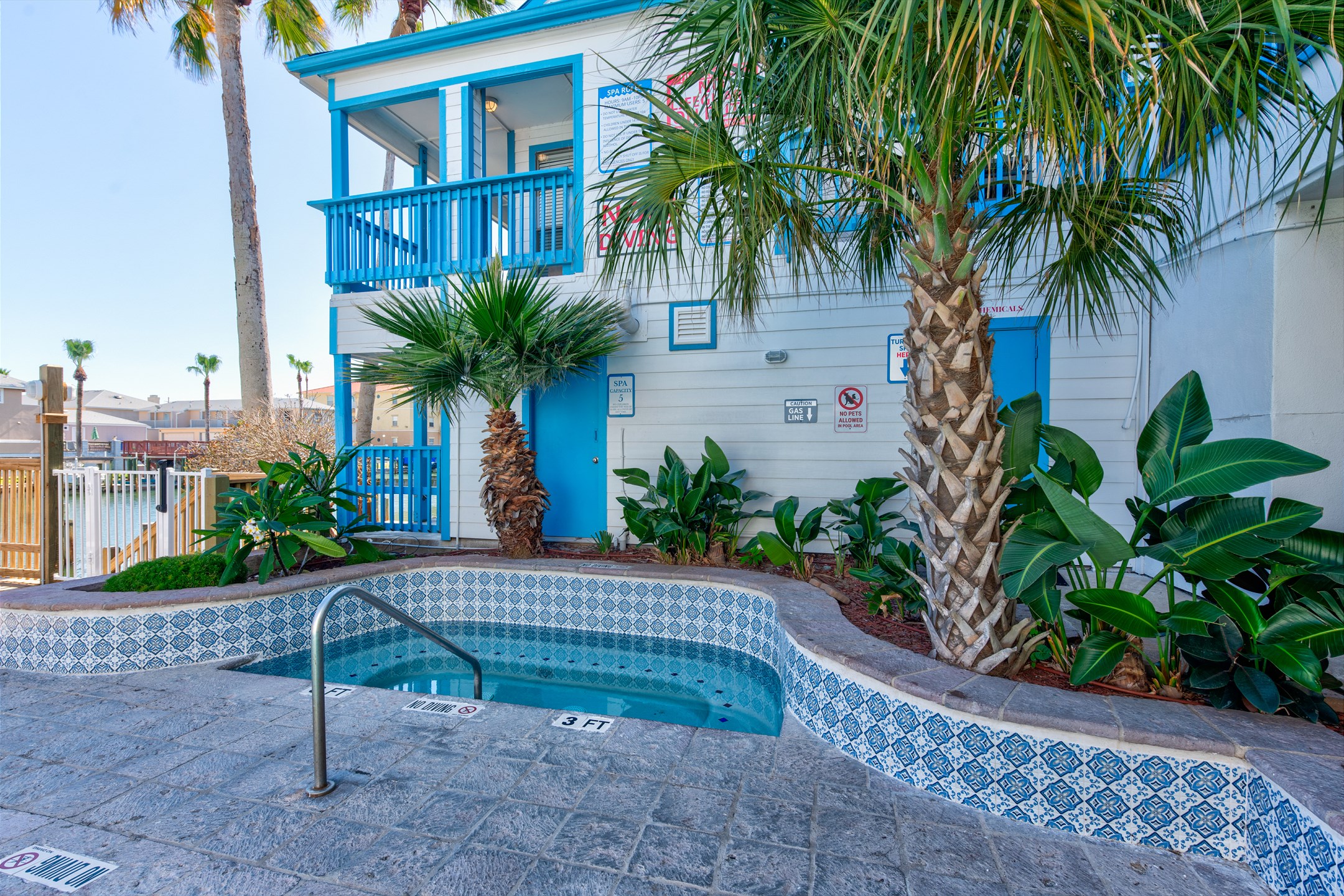 Inviting hot tub to relax in on your vacation, surrounded by enticing greenery