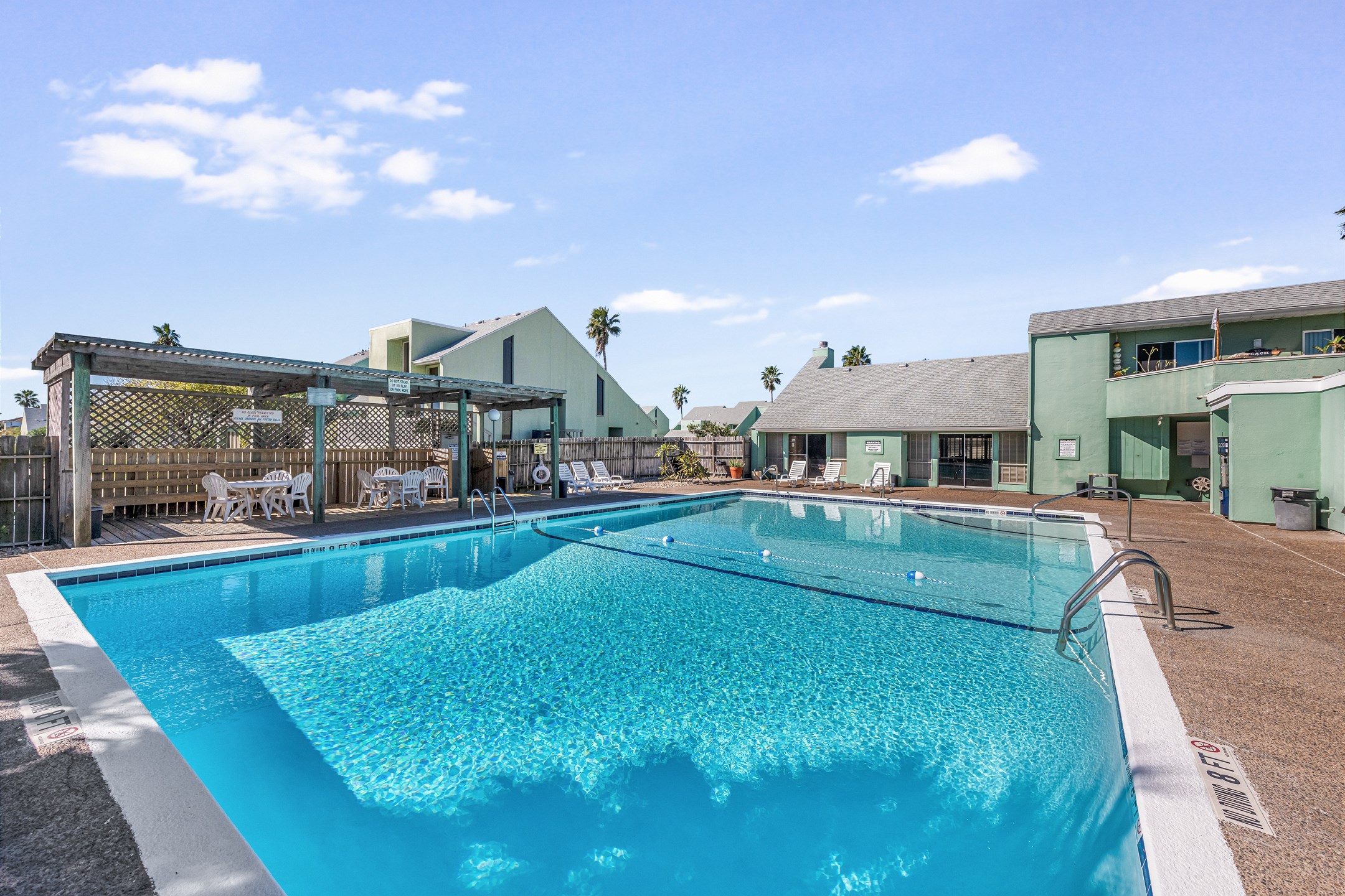 Elevate your vacation and indulge in our community pool offering plenty of seating and tables