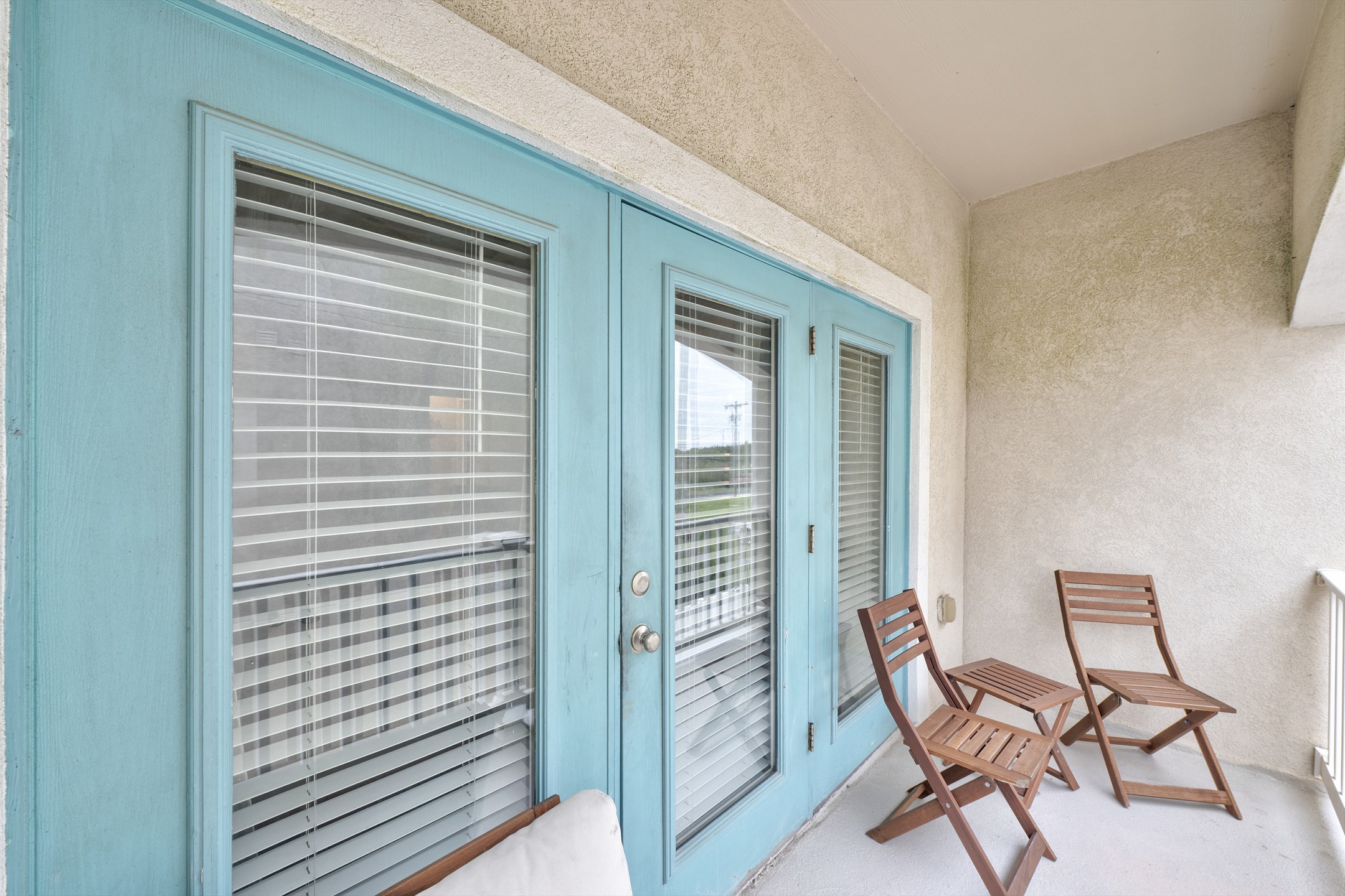 Private balcony off the living space with seating 