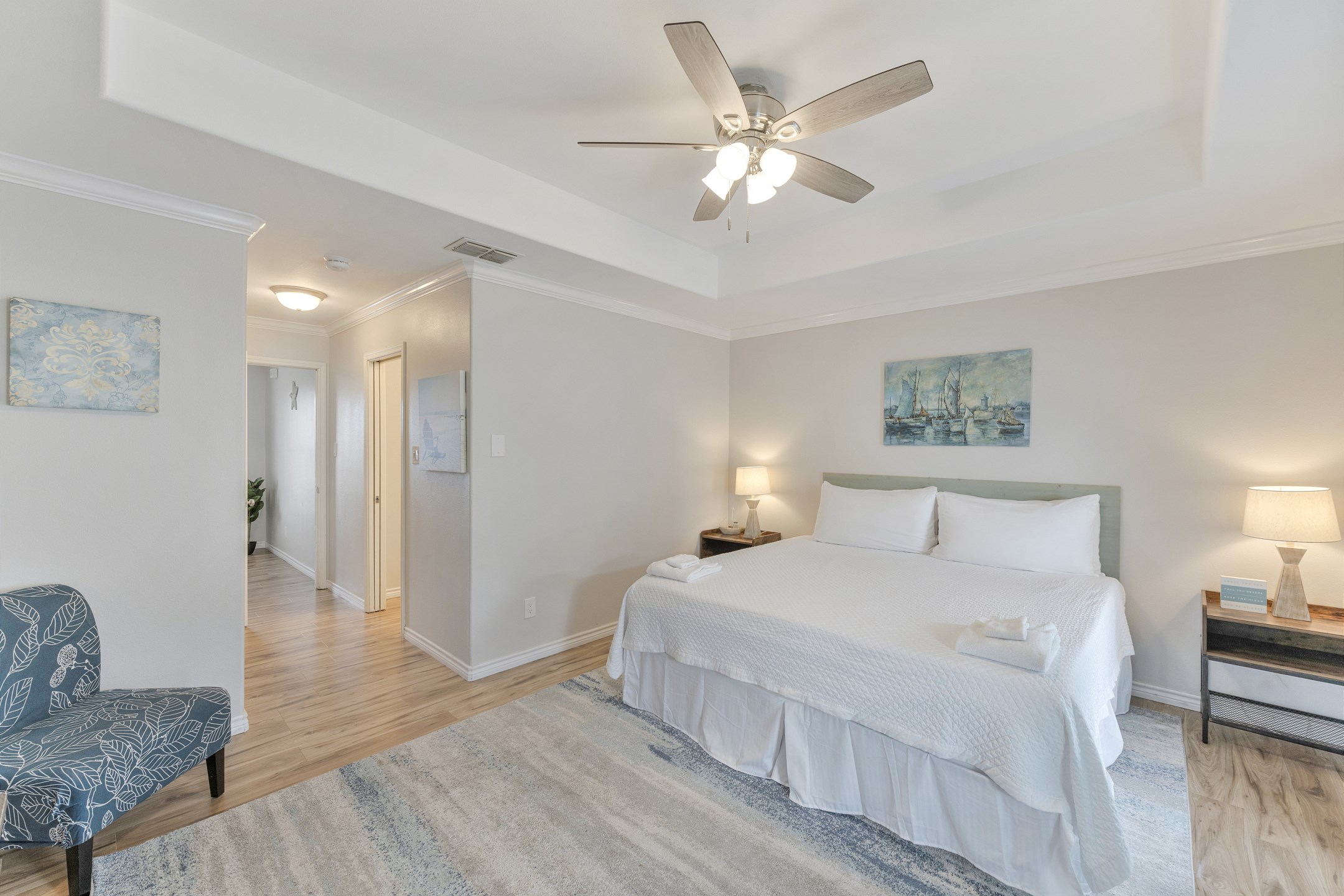 Primary bedroom on the third floor with king size bed, private bathroom, private balcony and flat screen TV