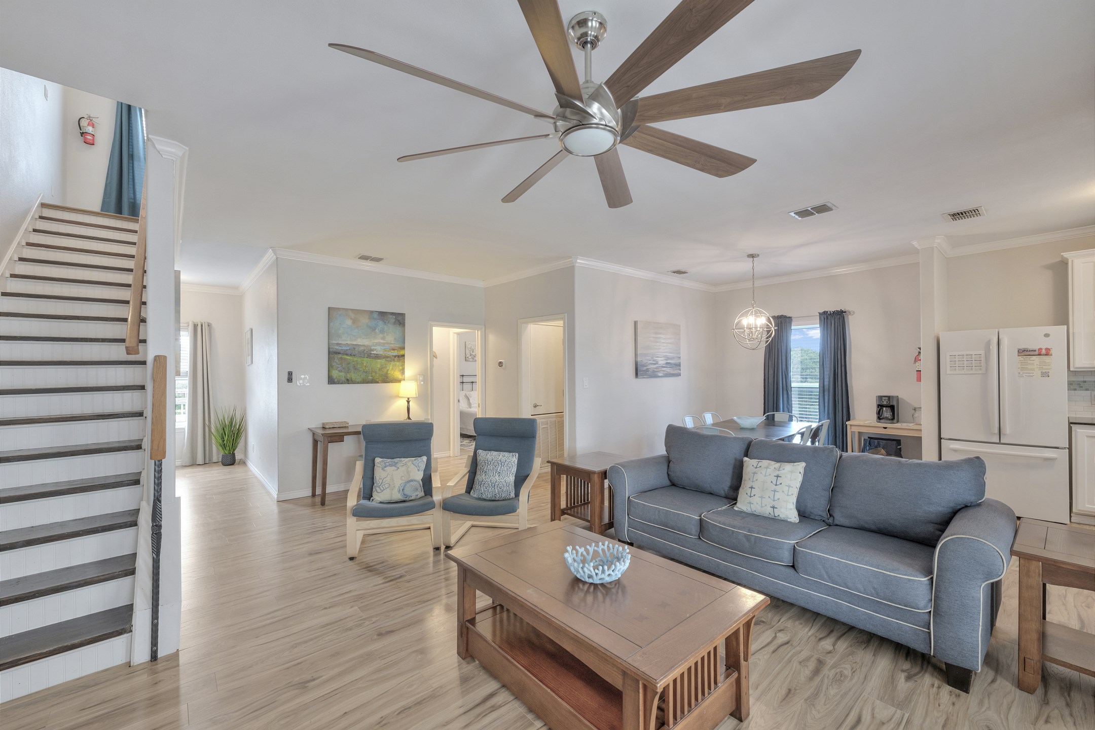 Great living space with sleeper sofa for extra arrangements and coastal decor 