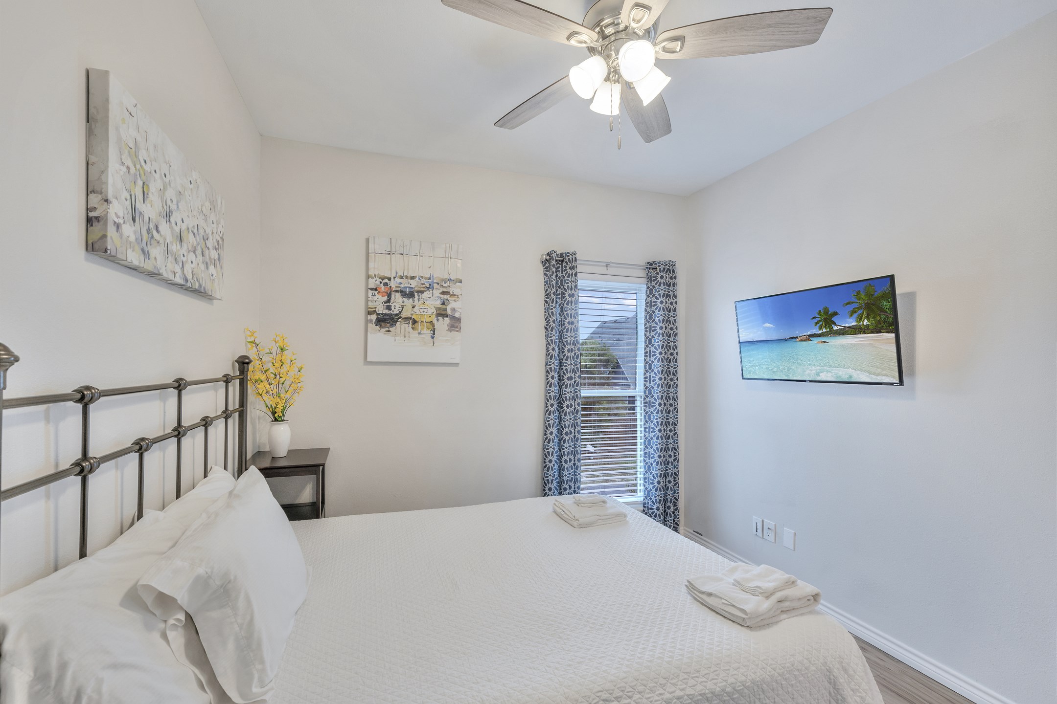 Second bedroom on the second floor with queen size bed and flat screen TV