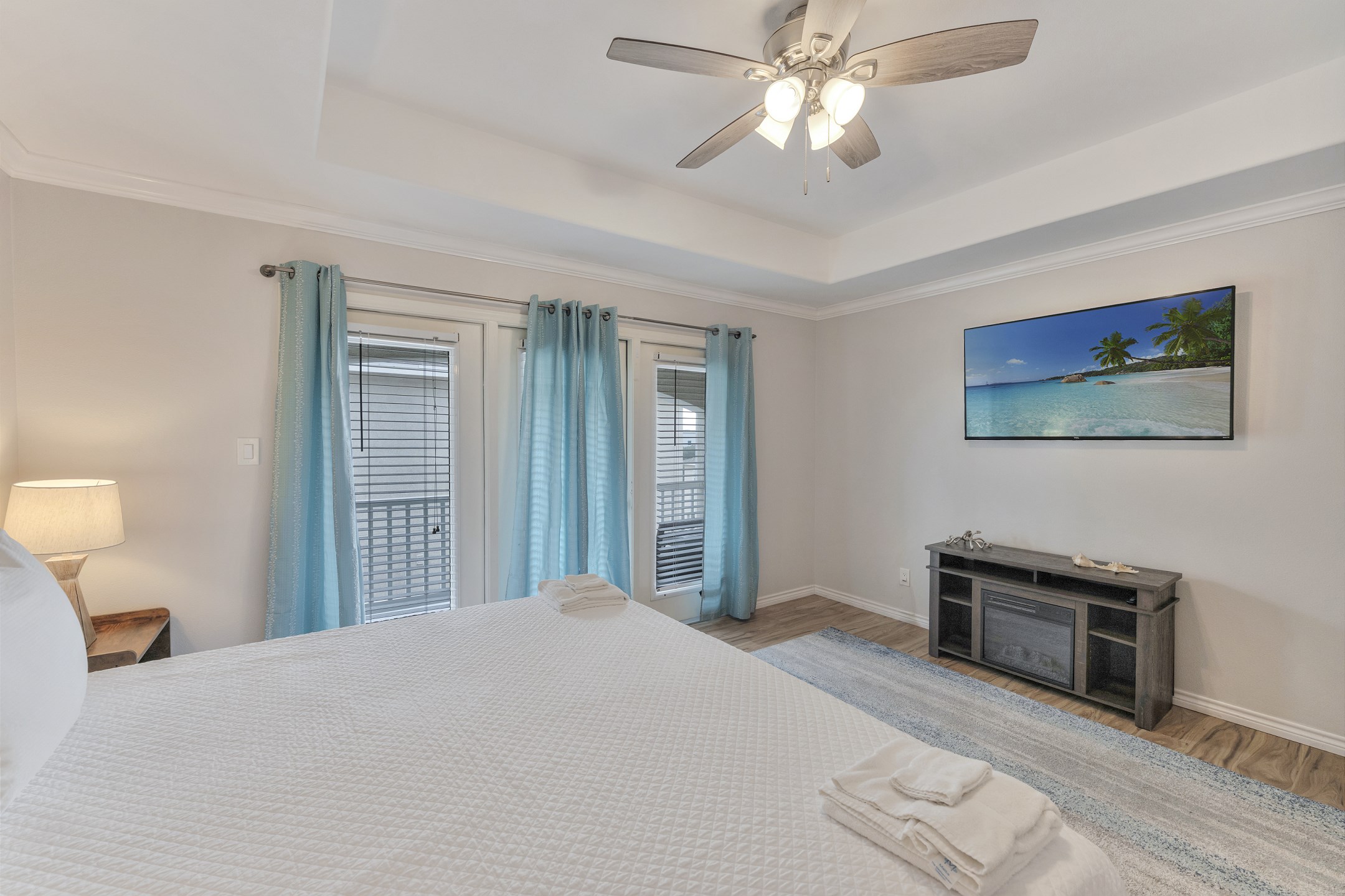 Primary bedroom on the third floor with king size bed, private bathroom, private balcony and flat screen TV