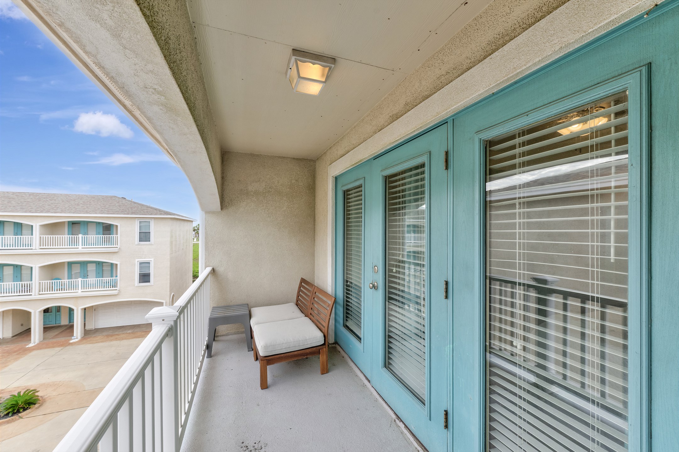 Private balcony off the living space with seating 