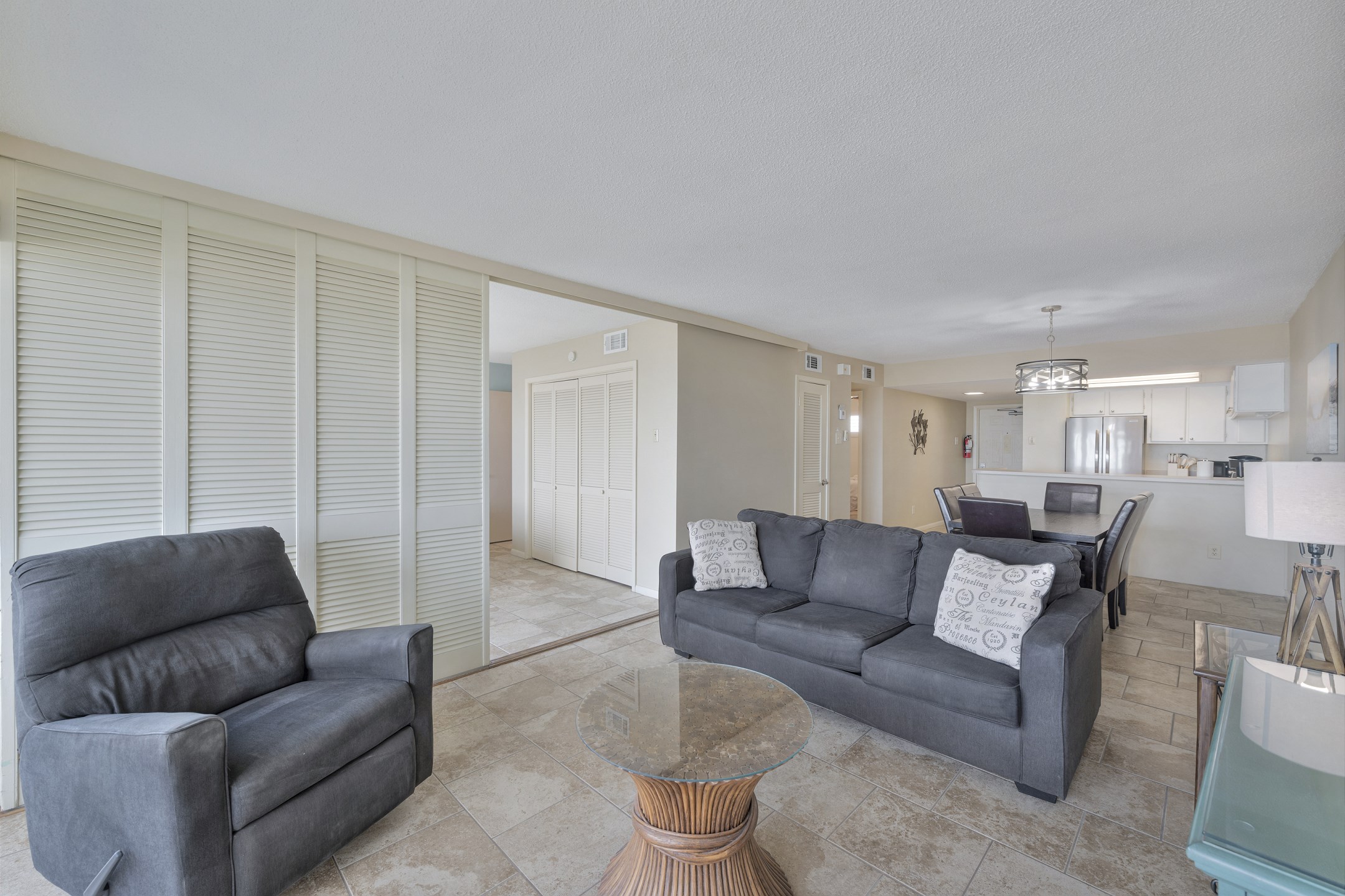 Comfortable gathering space designed for relaxation after a day at the beach offering a sleeper sofa for guests 