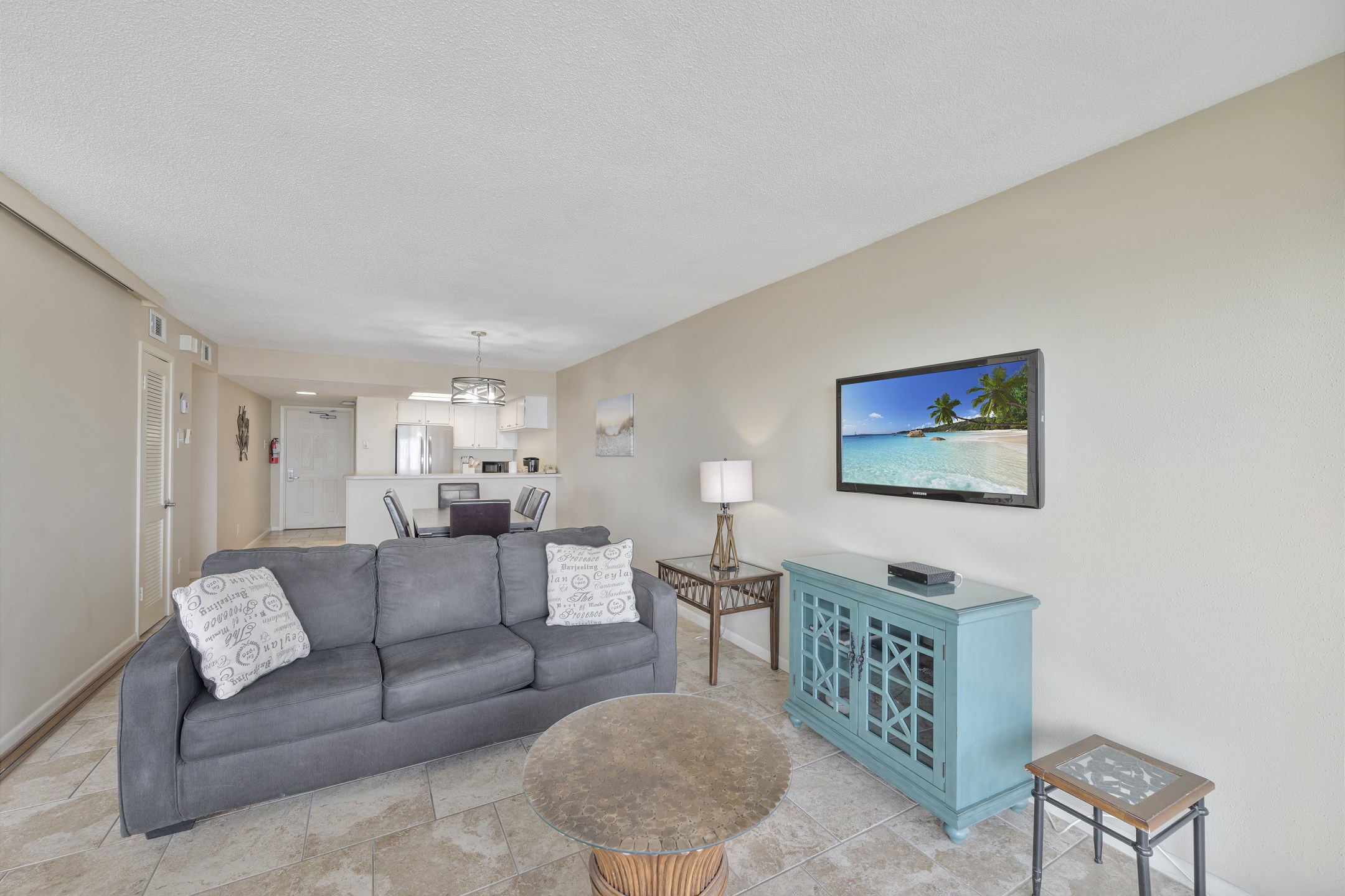 Stylish living room with chic décor and seamless flow into kitchen and dining