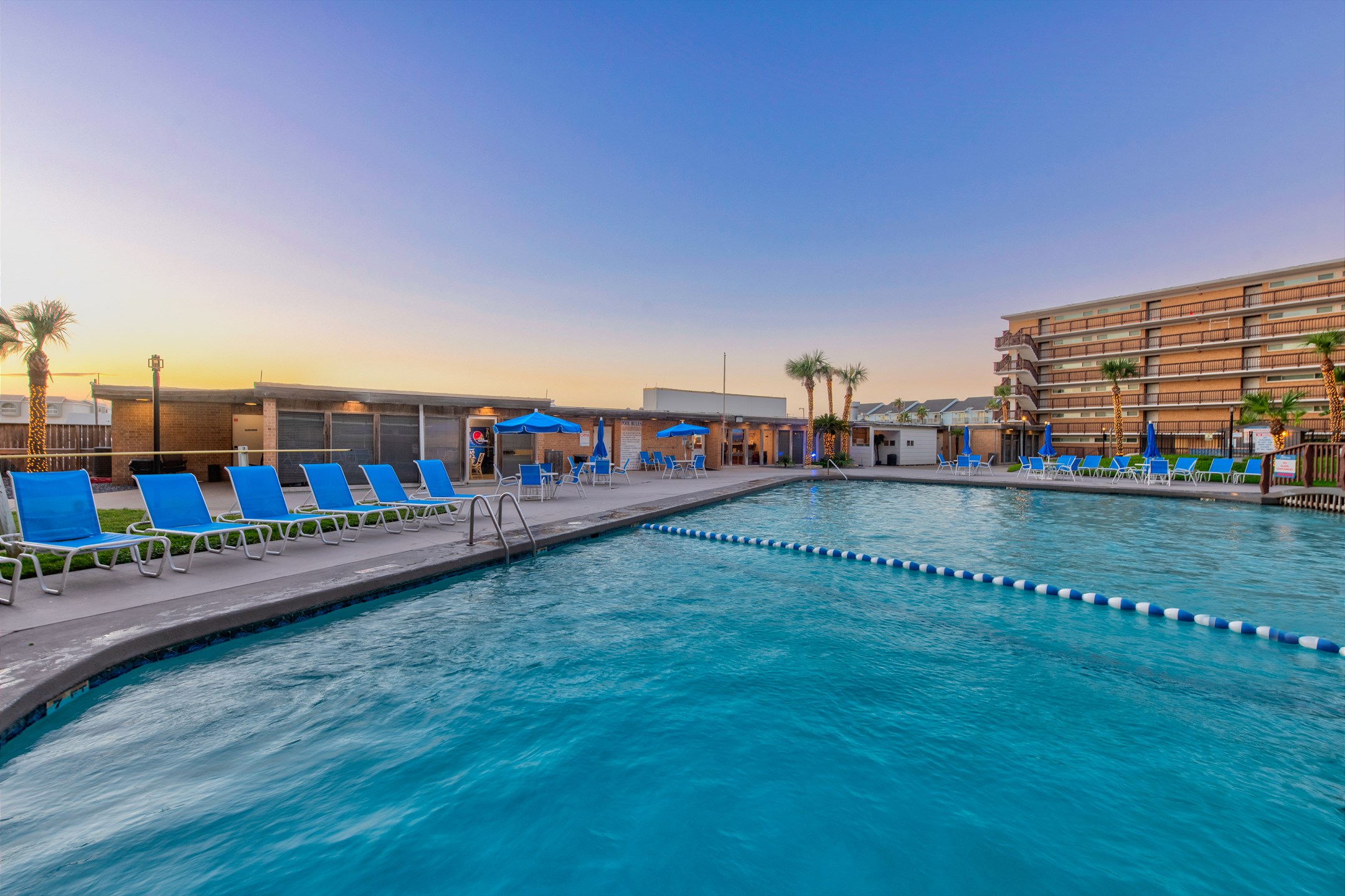 Experience a blissful coastal getaway at the heated pool with relaxing loungers