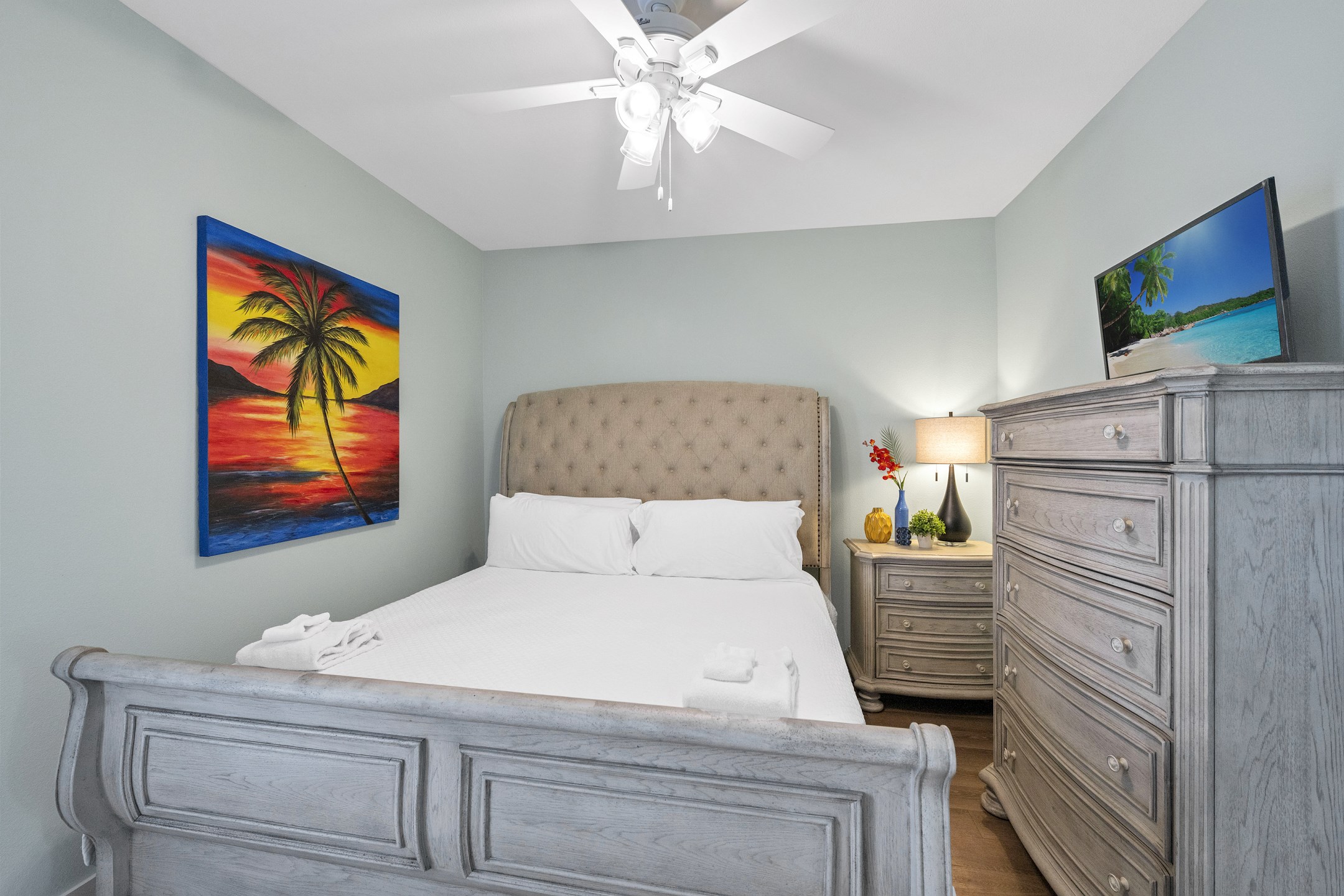 Primary bedroom on the first floor with king size bed and flat screen TV