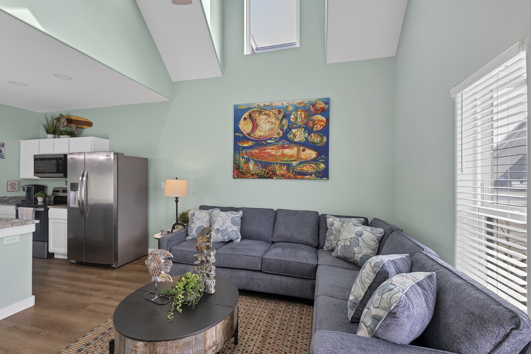 Bright open concept living area designed for family gatherings and island comfort