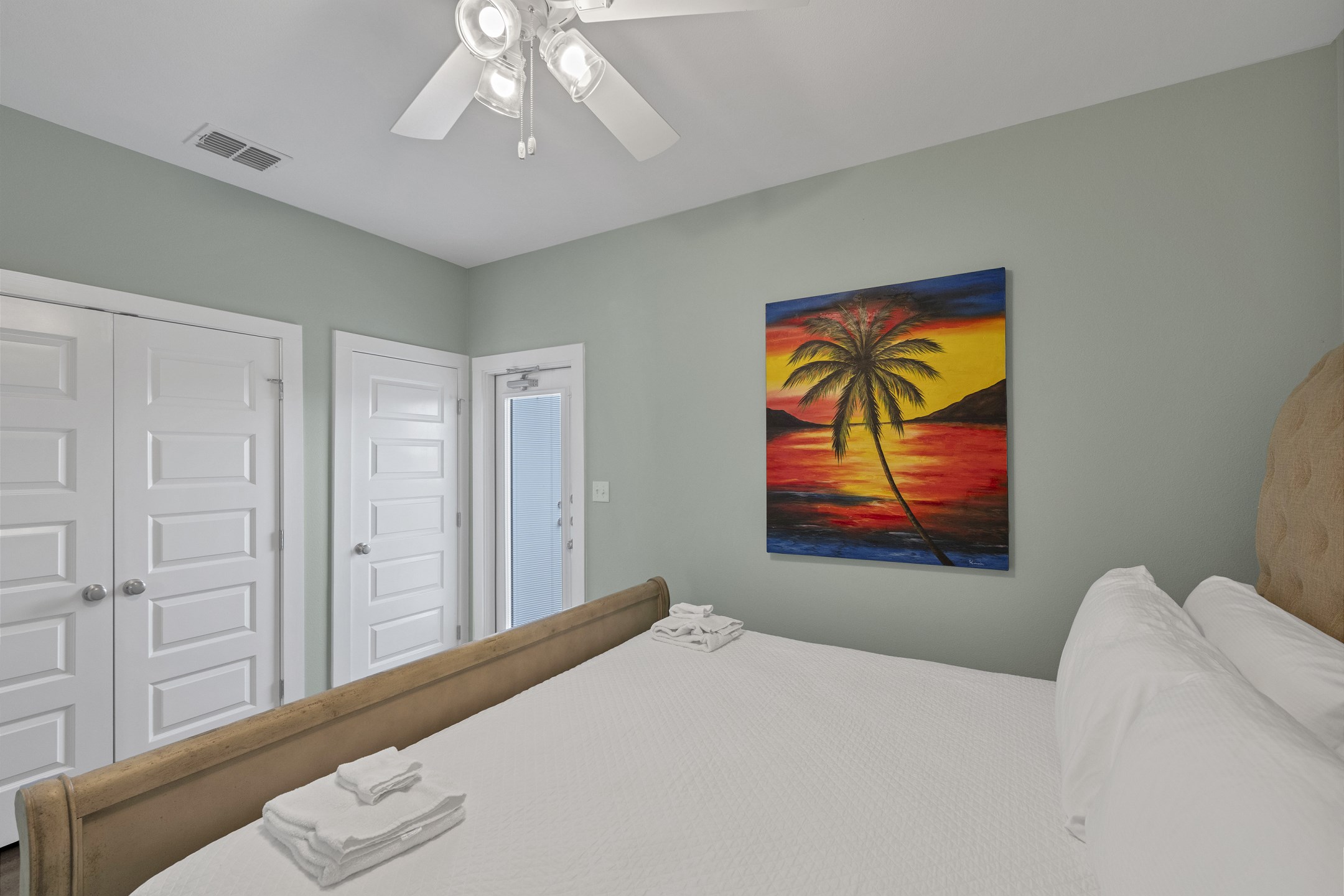 Primary bedroom on the first floor with king size bed and flat screen TV