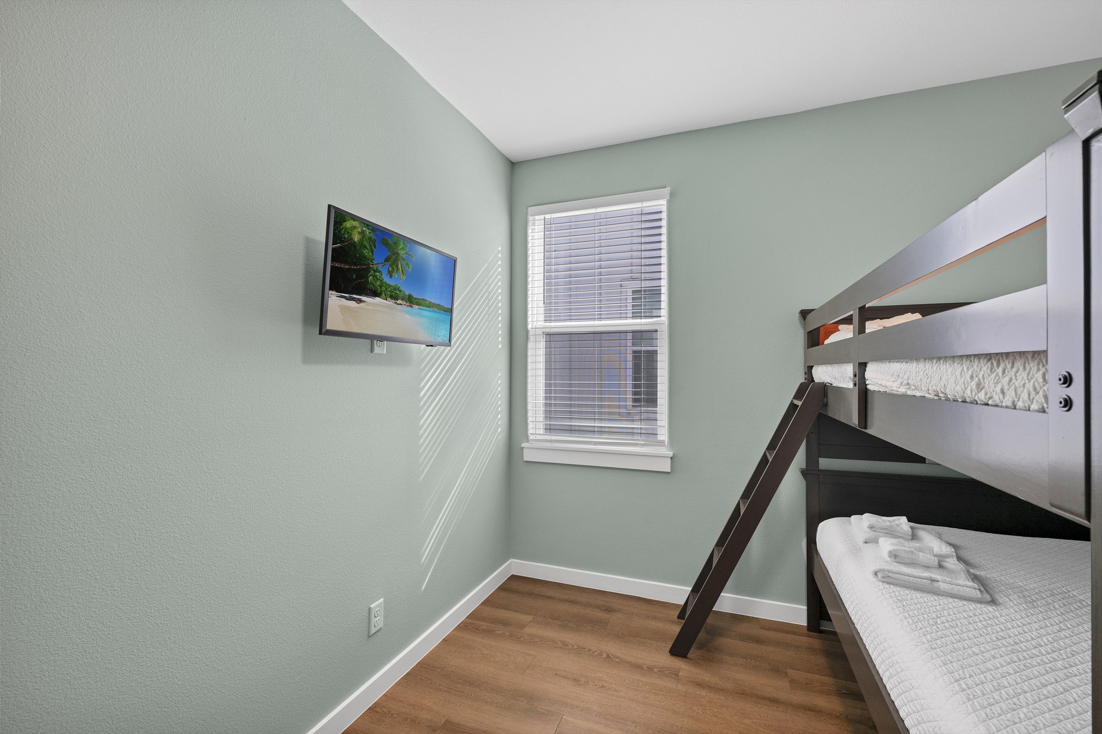 Third bedroom on the second floor with full over full size bunk bed and flat screen TV