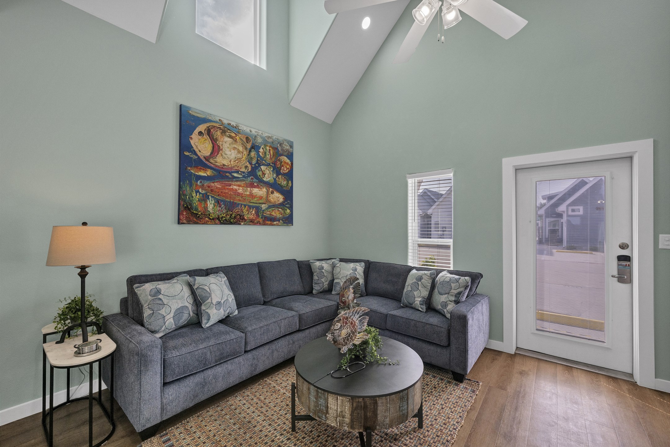 Comfortable living space with sleeper sofa and natural light shinning in